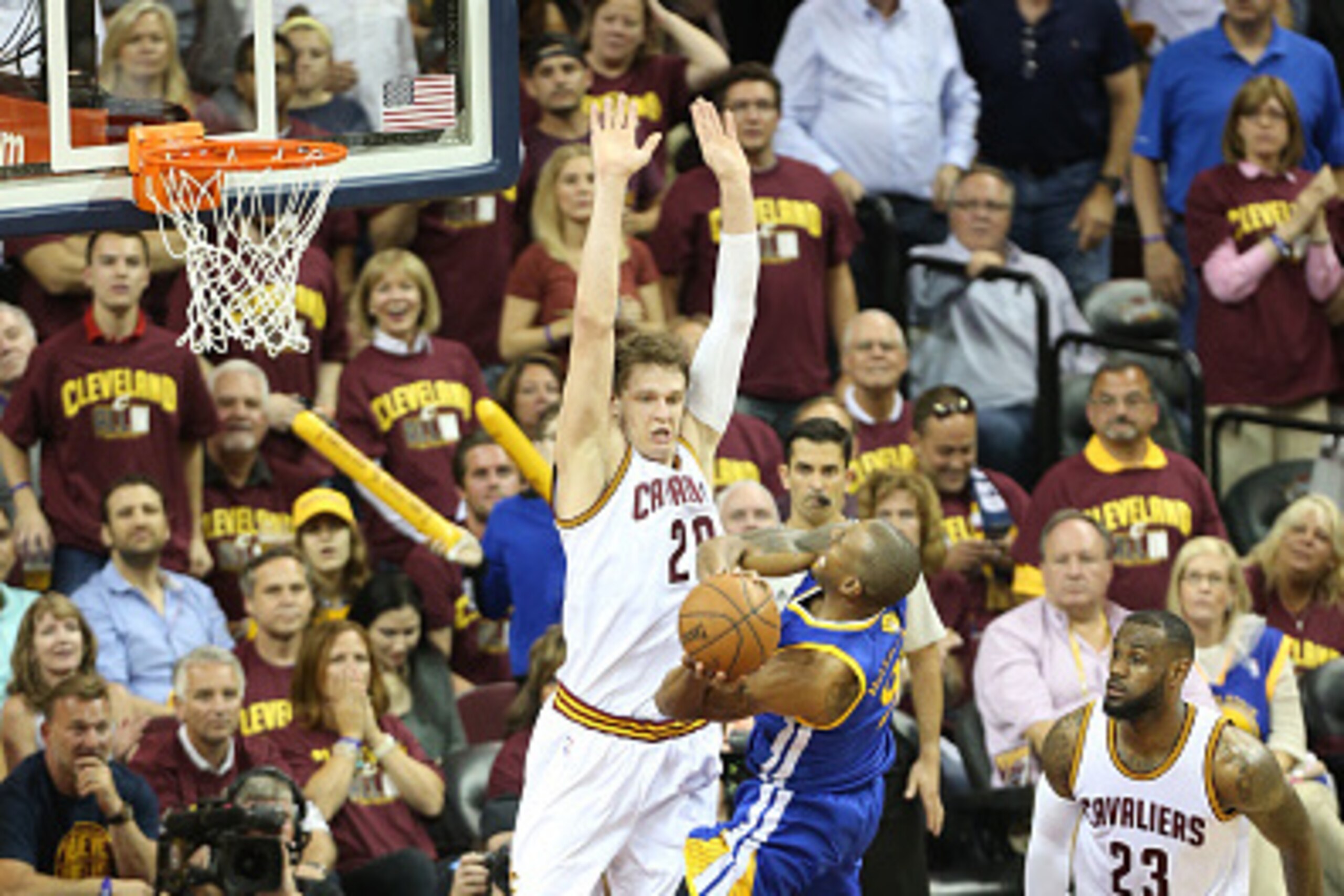 CLEVELAND, OH - JUNE 16: Timofey Mozgov #20 of the Cleveland Cavaliers defends against Andre Iguodala #9 of the Golden State Warriors in Game Six of the 2015 NBA Finals on June 16, 2015 at Quicken Loans Arena in Cleveland, Ohio. NOTE TO USER: User express