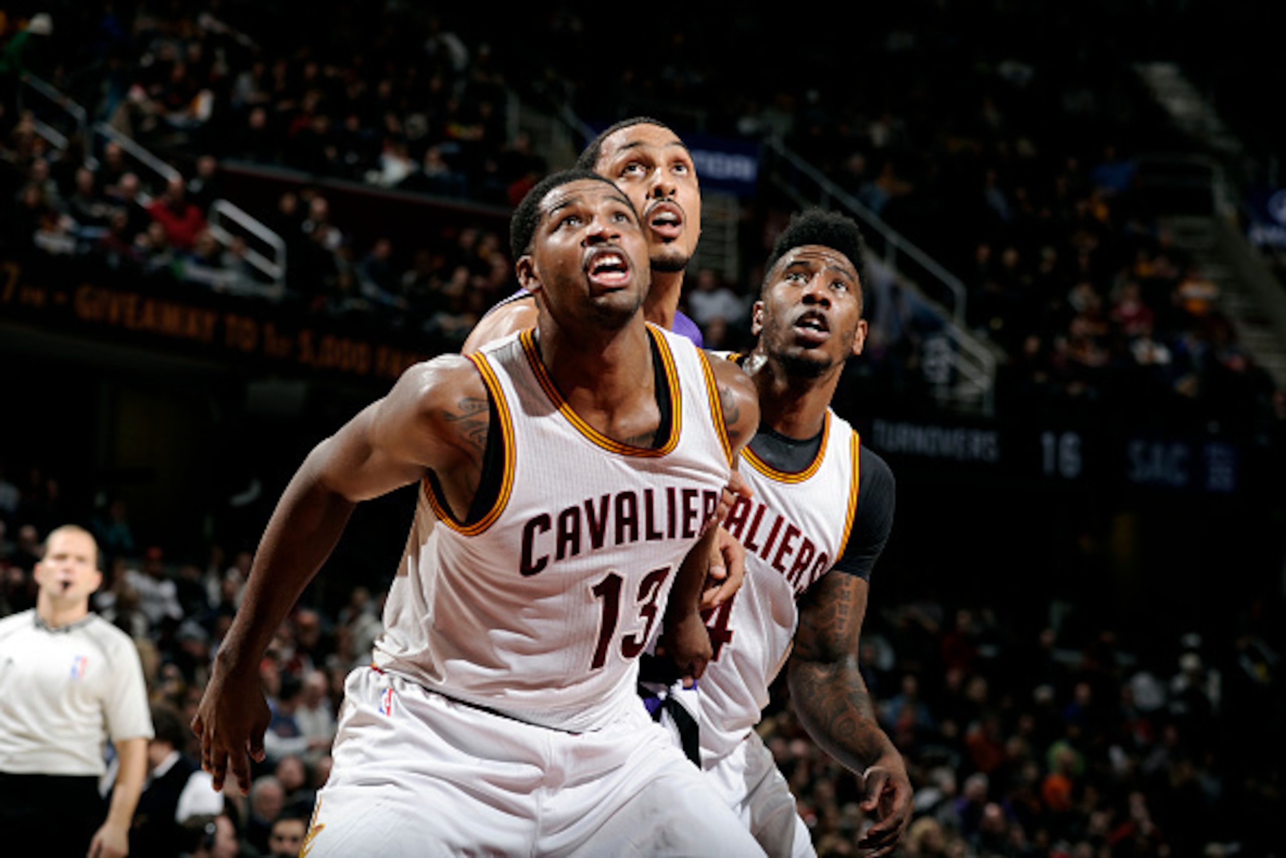 CLEVELAND, OH - JANUARY 30: Tristan Thompson #13 and Iman Shumpert #4 of the Cleveland Cavaliers battle for position against Ryan Hollins #5 of the Sacramento Kings at The Quicken Loans Arena on January 30, 2015 in Cleveland, Ohio. NOTE TO USER: User expr