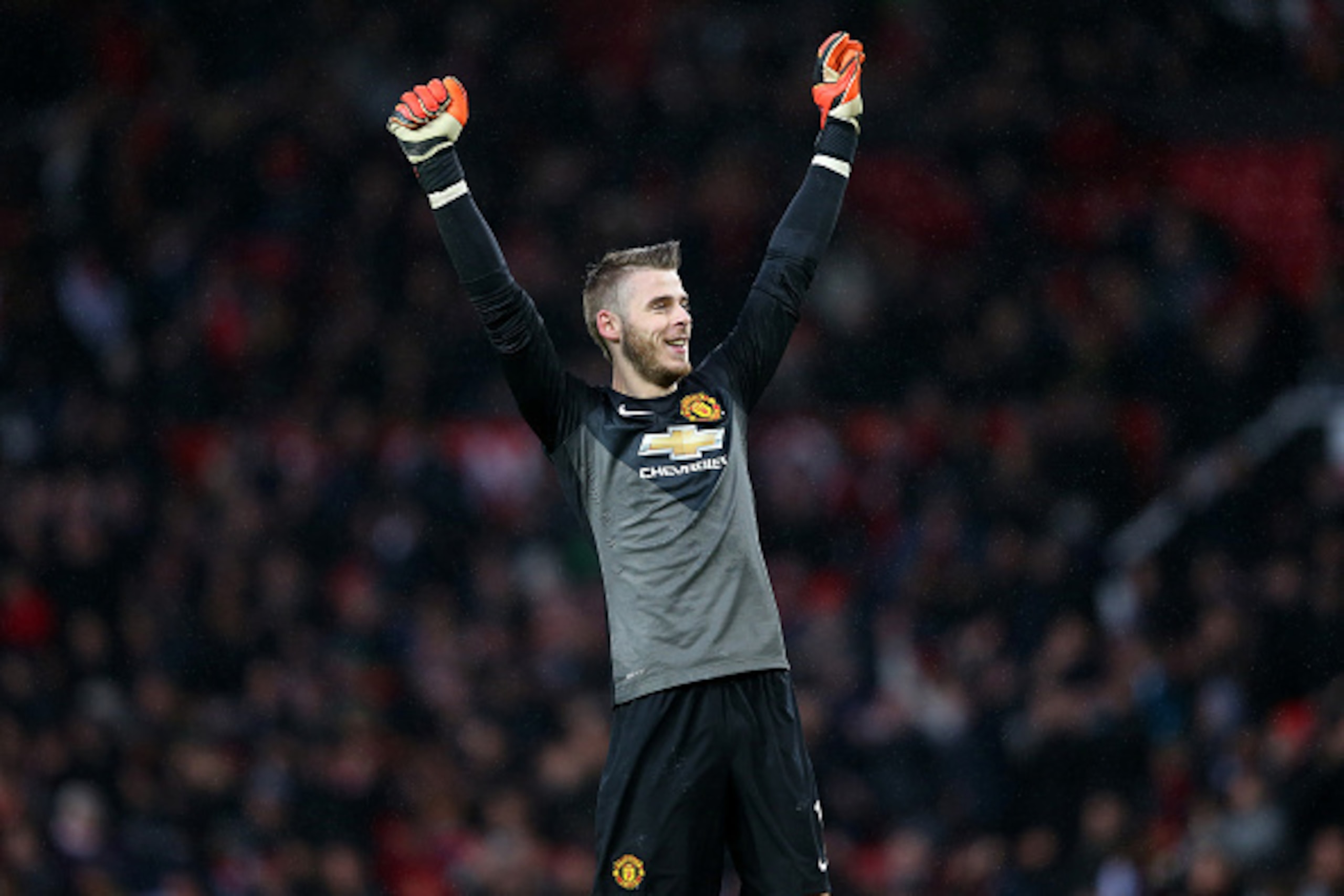 MANCHESTER, ENGLAND - DECEMBER 14:  David De Gea of Manchester United celebrates the third goal during the Barclays Premier League match between Manchester United and Liverpool at Old Trafford on December 14, 2014 in Manchester, England.  (Photo by Alex L