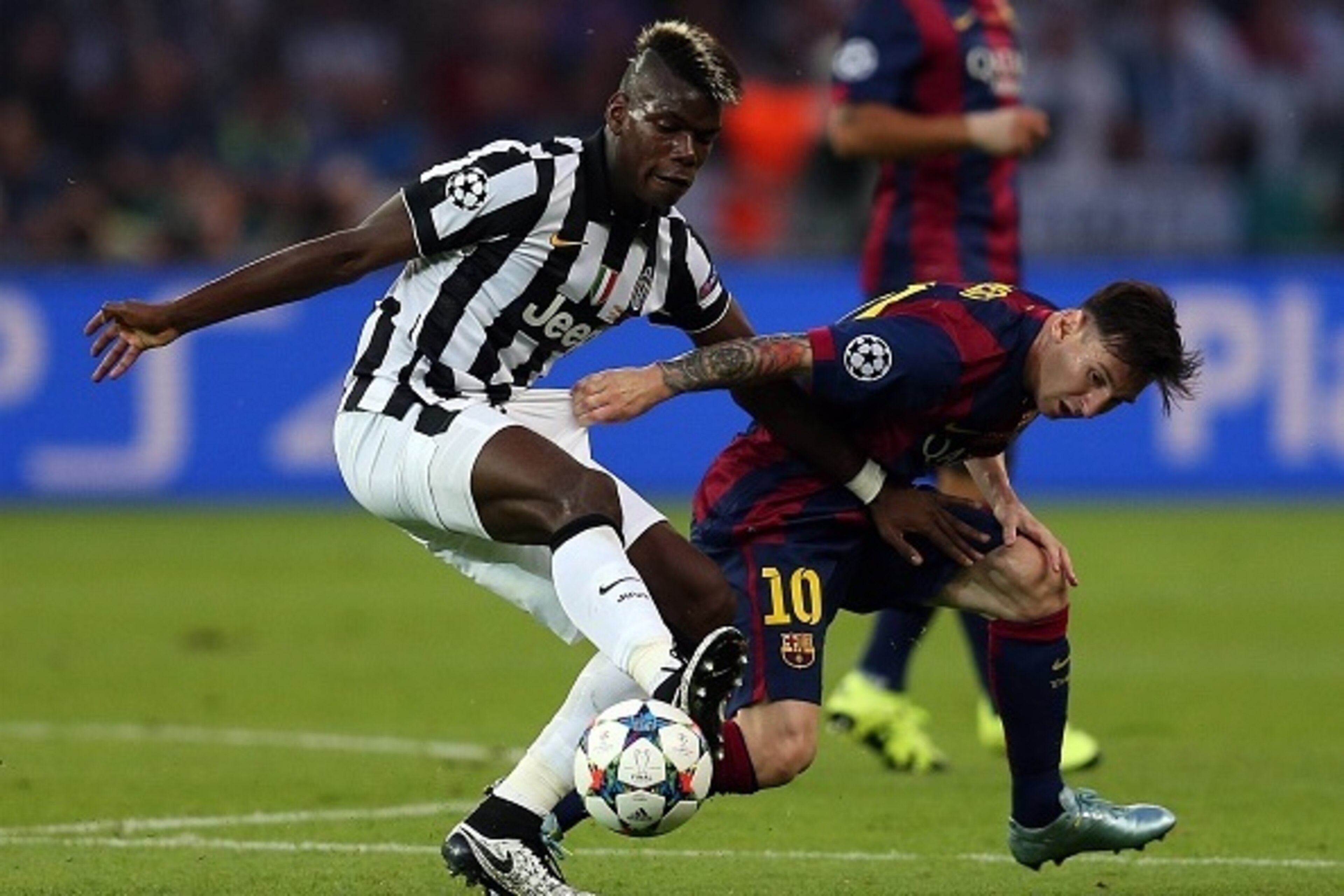 BERLIN, GERMANY - JUNE 6: Paul Pogba of Juventus in action with Lionel Messi of FC Barcelona during the UEFA Champions League Final match between Juventus and FC Barcelona at the Olympiastadion on June 6, 2015 in Berlin, Germany. (Photo by Chris Brunskill BERLIN, GERMANY - JUNE 6: Paul Pogba of Juventus in action with Lionel Messi of FC Barcelona during the UEFA Champions League Final match between Juventus and FC Barcelona at the Olympiastadion on June 6, 2015 in Berlin, Germany. (Photo by Chris Brunskill