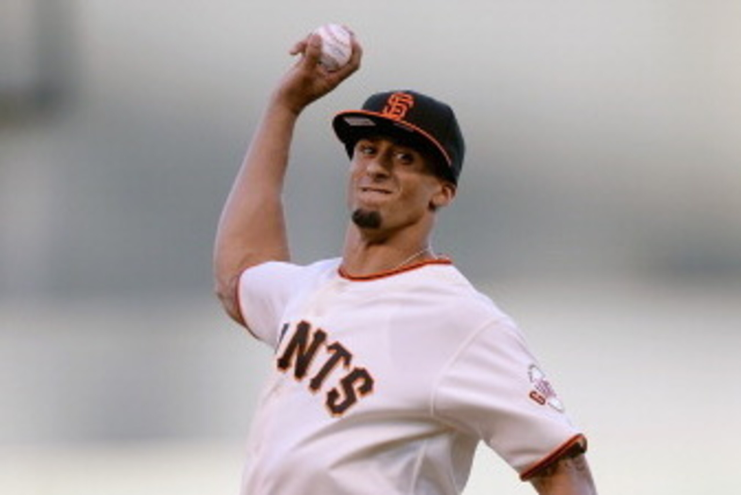 SAN FRANCISCO, CA - JUNE 21:  San Francisco 49ers quarterback Colin Kaepernick throws out the ceremonial first pitch before a Major League Baseball game between the Miami Marlins and San Francisco Giants at AT&T Park on June 21, 2013 in San Francisco, Cal