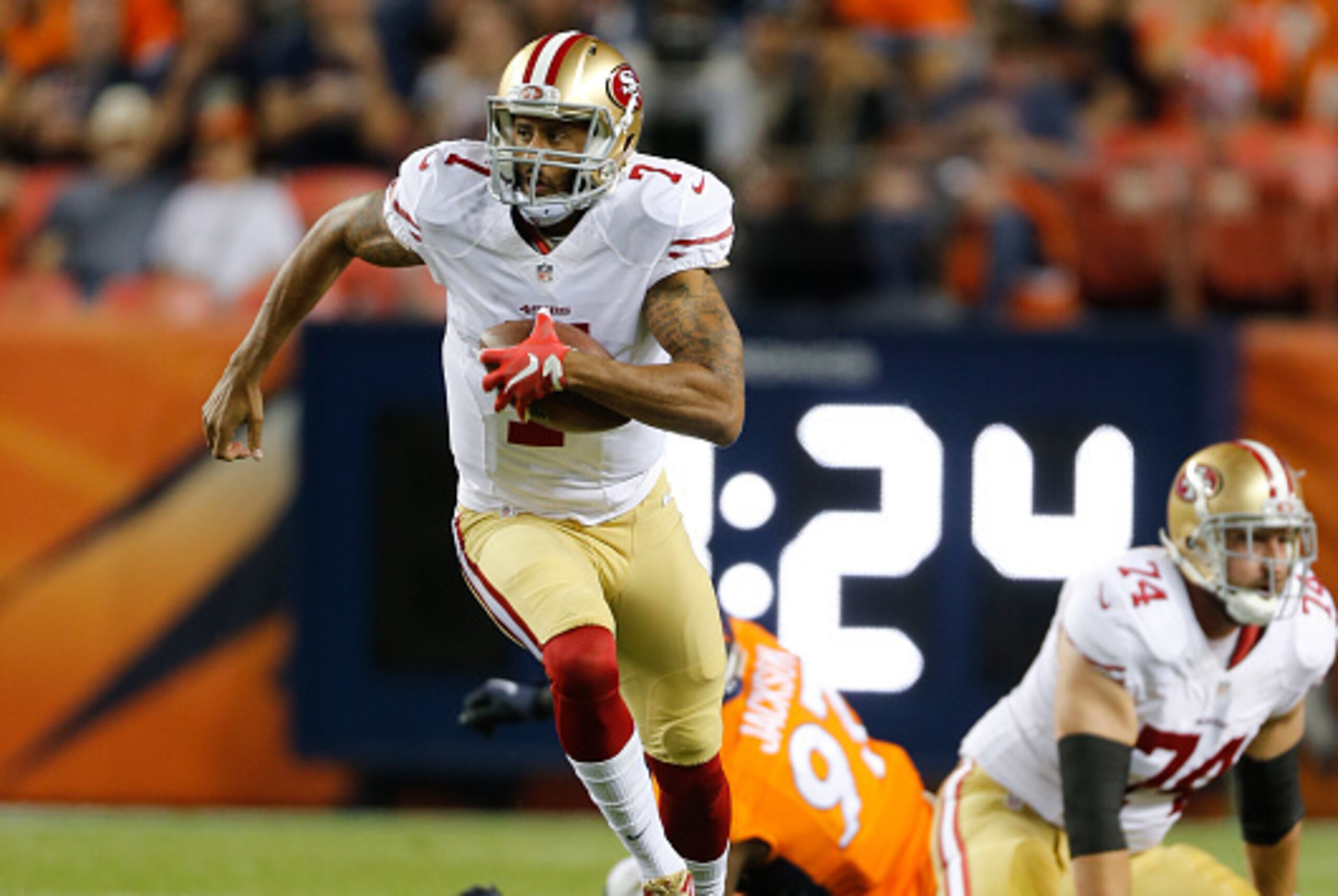 DENVER, CO - AUGUST 29: Colin Kaepernick #7 of the San Francisco 49ers rushes during the game against the Denver Broncos at Sports Authority Field on August 29, 2015 in Denver, Colorado. The Broncos defeated the 49ers 19-12. (Photo by Michael Zagaris/San 