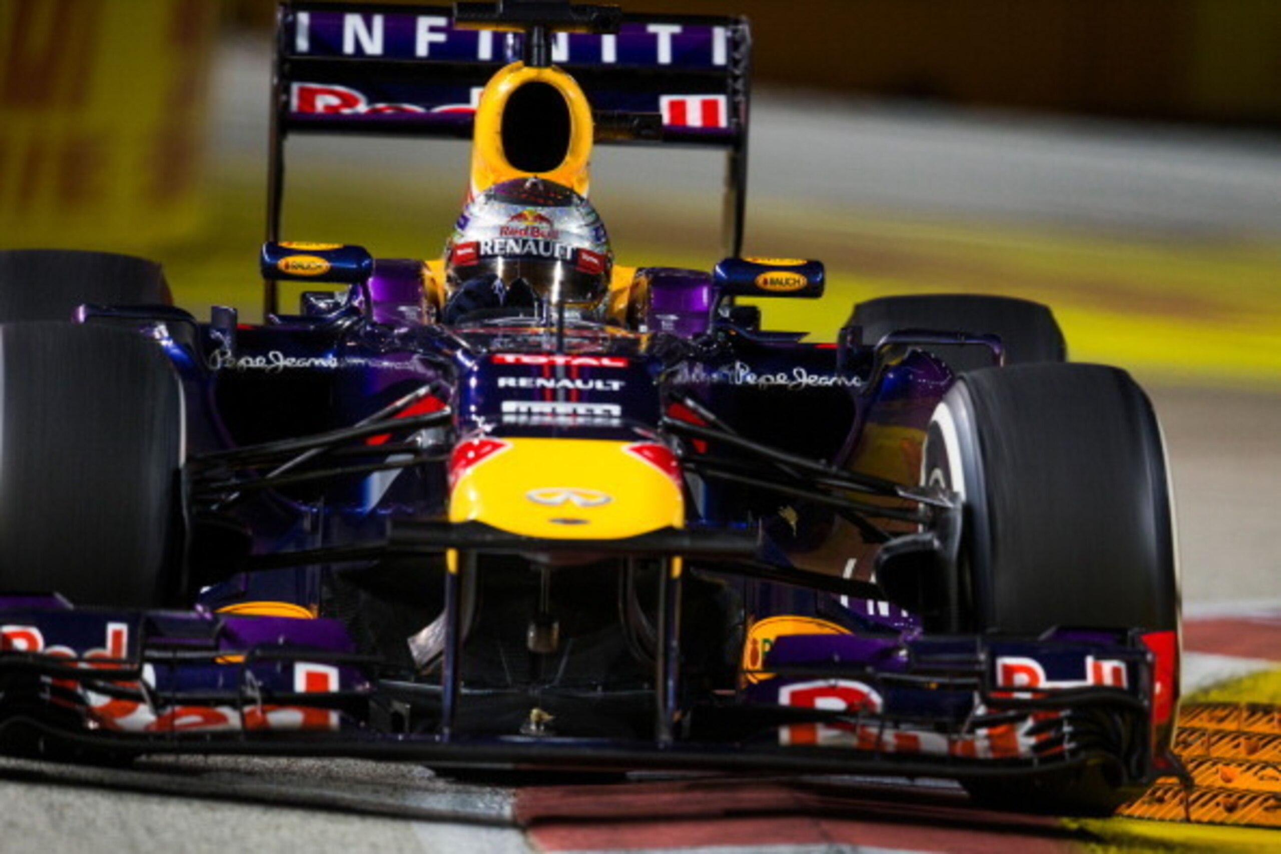 SINGAPORE - SEPTEMBER 22:  Sebastian Vettel of Germany and Red Bull during the Singapore Formula One Grand Prix at Marina Bay Street Circuit on September 22, 2013 in Singapore, Singapore.  (Photo by Peter J Fox/Getty Images)