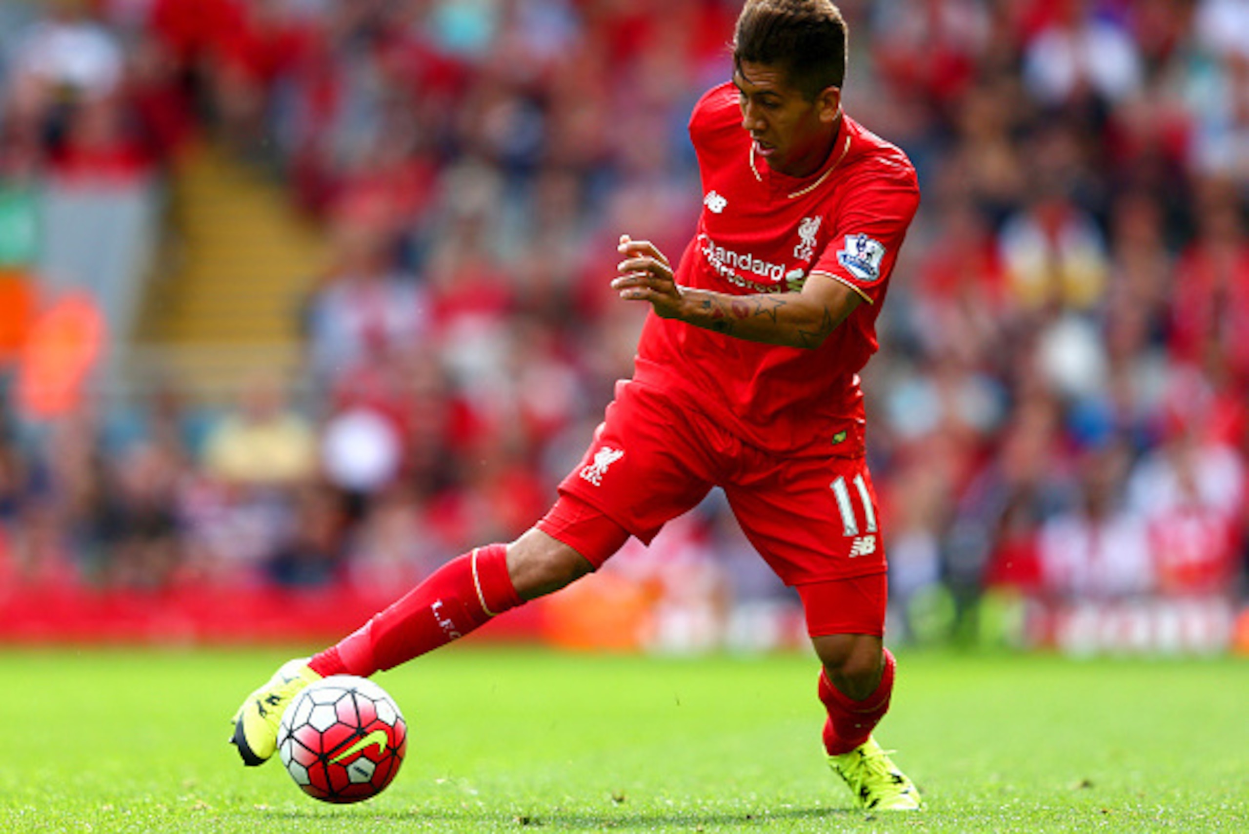 LIVERPOOL, ENGLAND - AUGUST 29: Roberto Firmino of Liverpool in action during the Barclays Premier League match between Liverpool and West Ham United at Anfield on August 29, 2015 in Liverpool, England.  (Photo by Clive Mason/Getty Images)