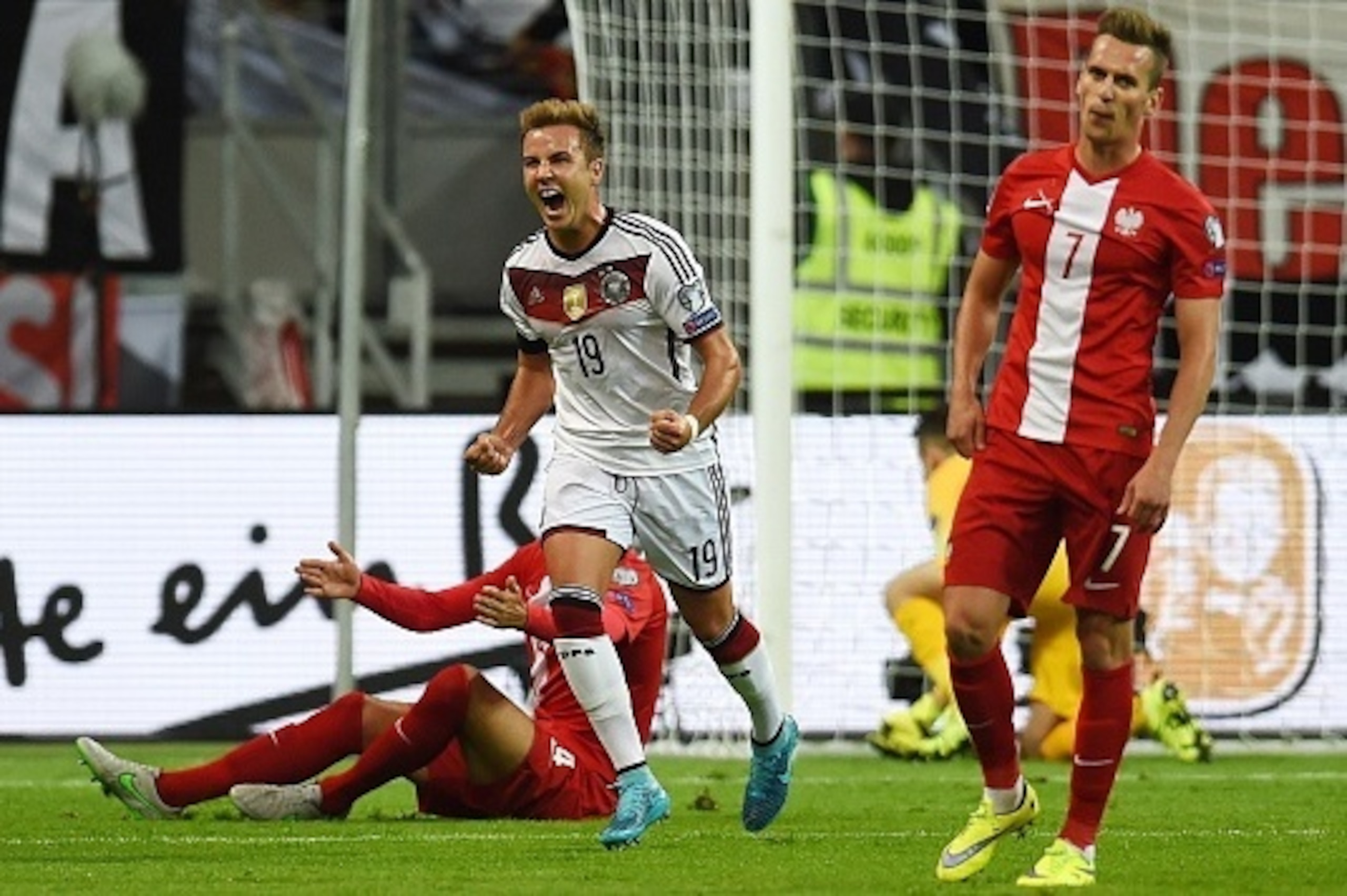 Germany's forward Mario Goetze (C) celebrates scoring during the Euro 2016 qualifying football match between Germany and Poland in Frankfurt am Main, central Germany, on September 4, 2015.   AFP PHOTO / PATRIK STOLLARZ        (Photo credit should read PAT