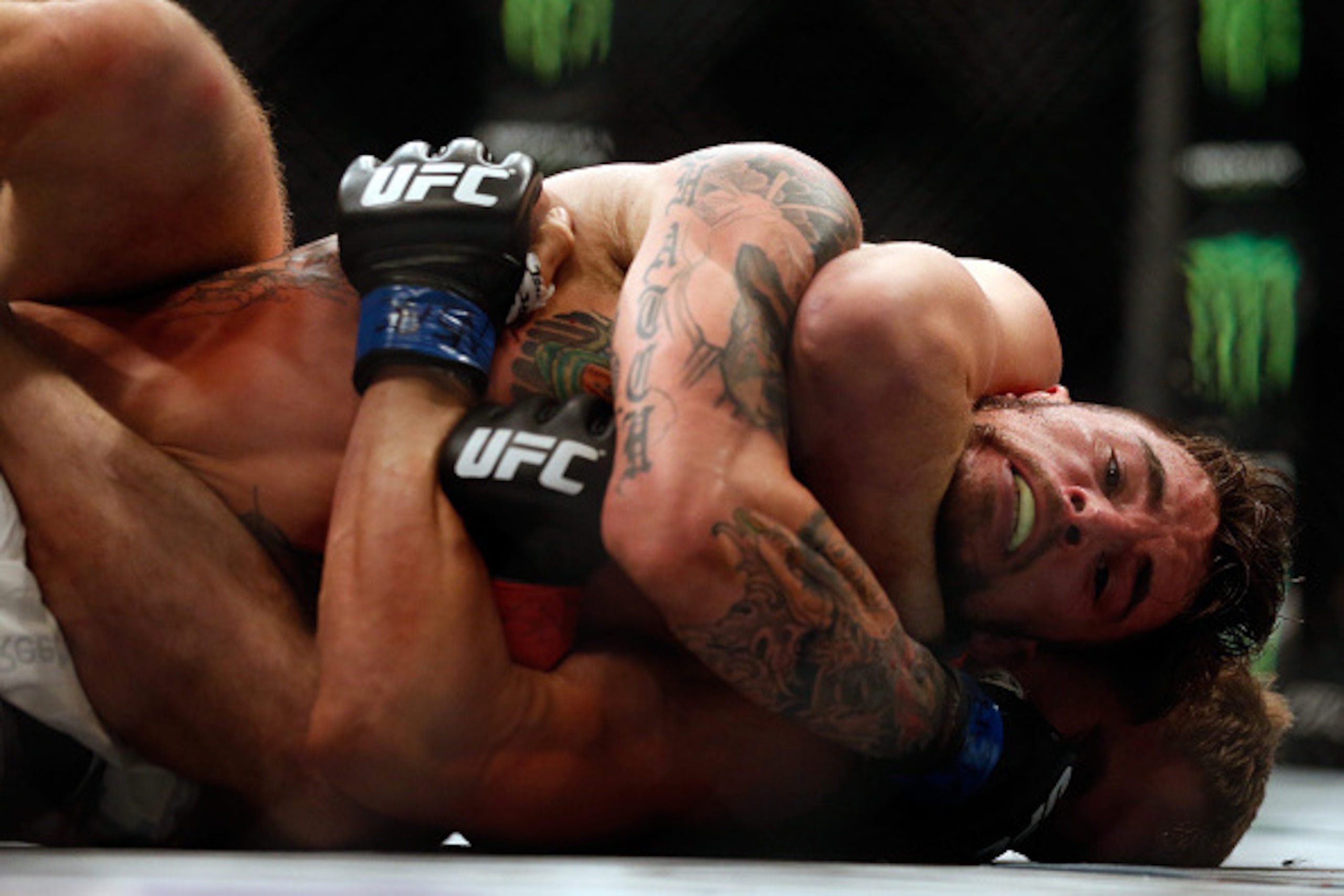 LAS VEGAS, NV - JULY 11:  Gunnar Nelson attempts to submit Brandon Thatch (front) in their welterweight fight during the UFC 189 event inside MGM Grand Garden Arena on July 11, 2015 in Las Vegas, Nevada.  (Photo by Christian Petersen/Zuffa LLC/Zuffa LLC v