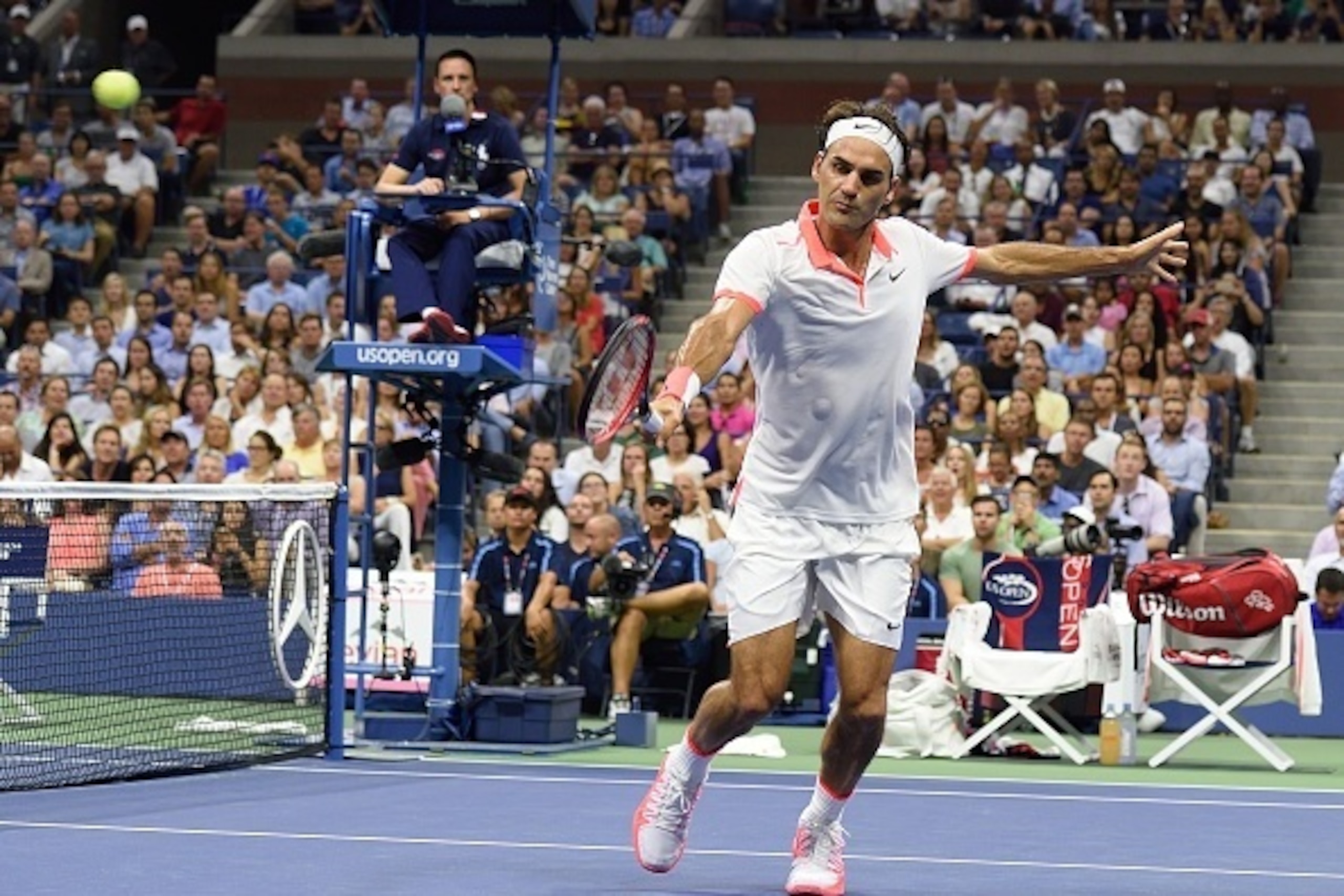 Roger Federer of Switzerland hits a return to Steve Darcis of Belgium during the 2015 US Open men's singles round two match at the USTA Billie Jean King National Tennis Center September 3, 2015 in New York.        AFP PHOTO /  DON EMMERT        (Photo cre