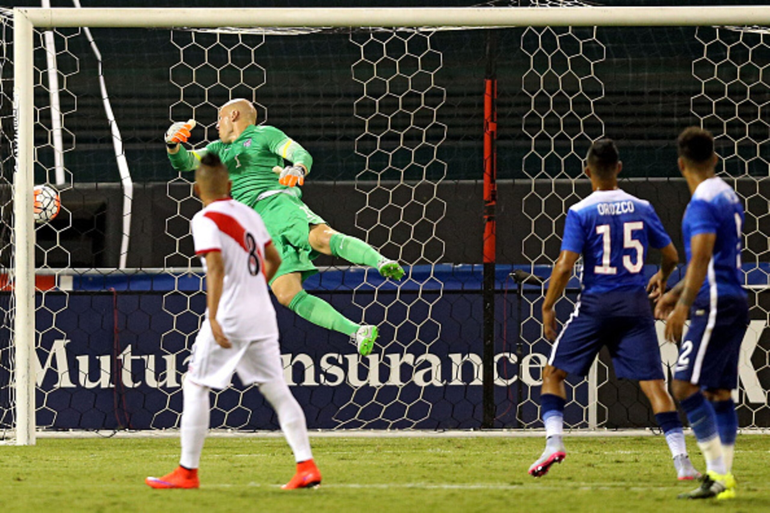 WASHINGTON, DC - SEPTEMBER 04: Goal keeper Brad Guzan #1 of the United States cannot make a save on a goal by Daniel Chavez #23 of Peru (not pictured) in the first half during an international friendly at RFK Stadium on September 4, 2015 in Washington, DC