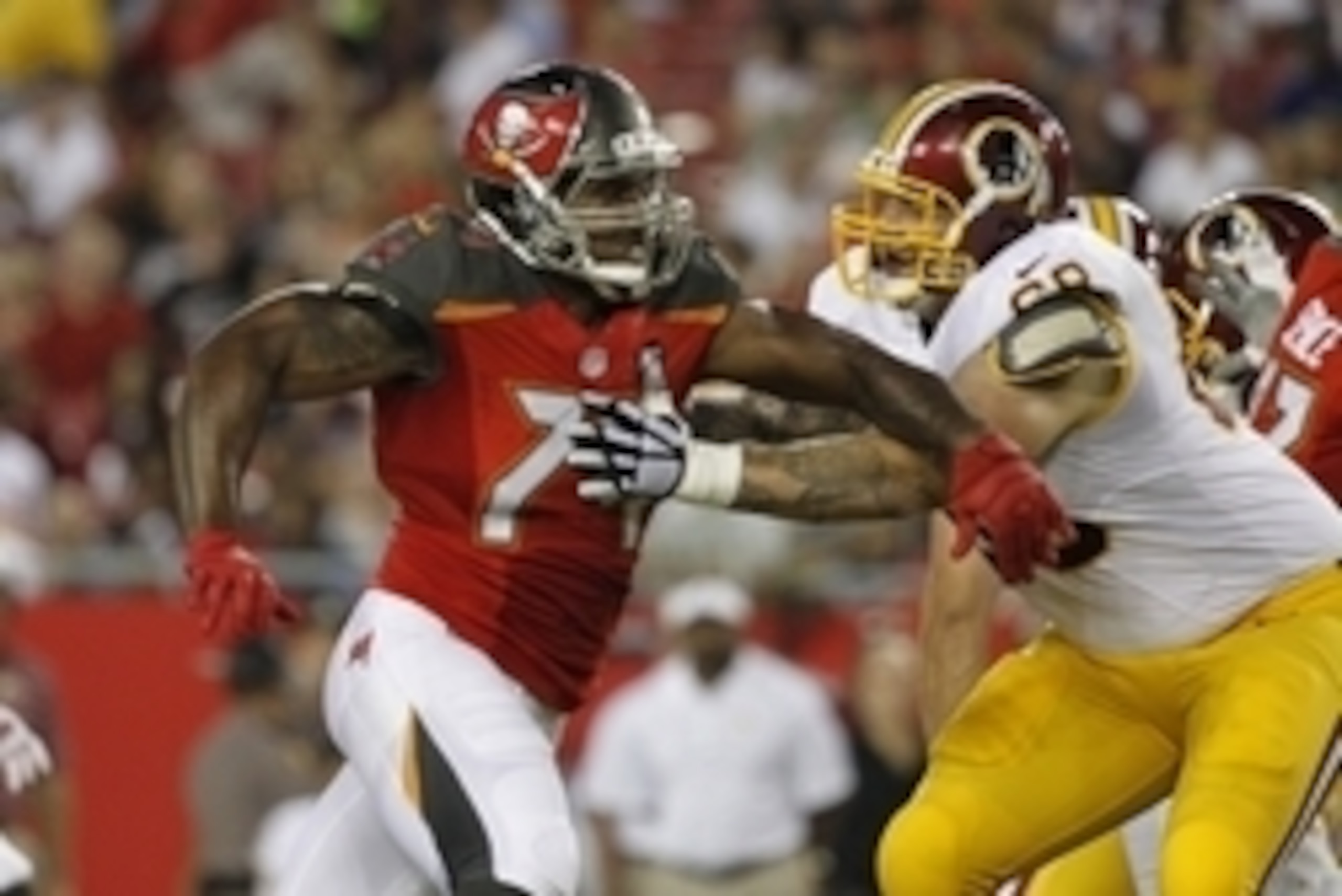 Aug 28, 2014; Tampa, FL, USA; Tampa Bay Buccaneers defense end Larry English (74) runs as Washington Redskins tackle Tom Compton (68) blocks during the first half at Raymond James Stadium. Mandatory Credit: Kim Klement-USA TODAY Sports