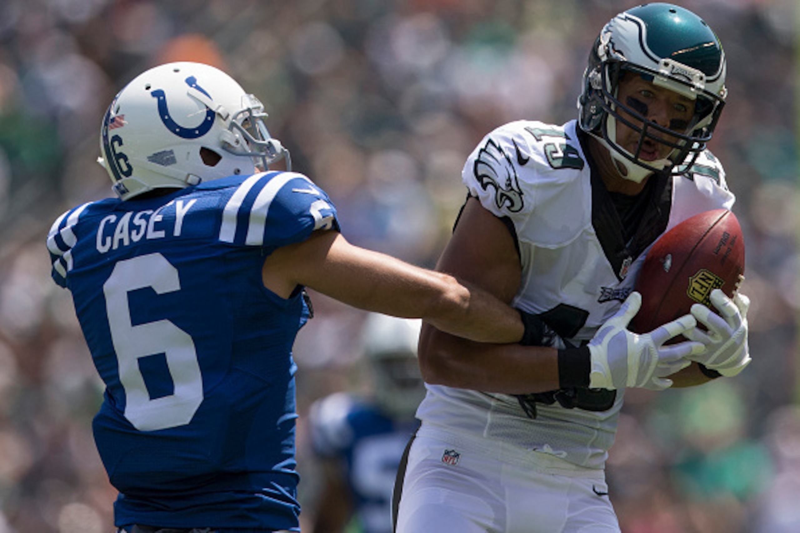 PHILADELPHIA, PA - AUGUST 16: Miles Austin #19 of the Philadelphia Eagles catches a pass with Chance Casey #6 of the Indianapolis Colts defending on the play in the first quarter of the preseason game on August 16, 2015 at Lincoln Financial Field in Phila