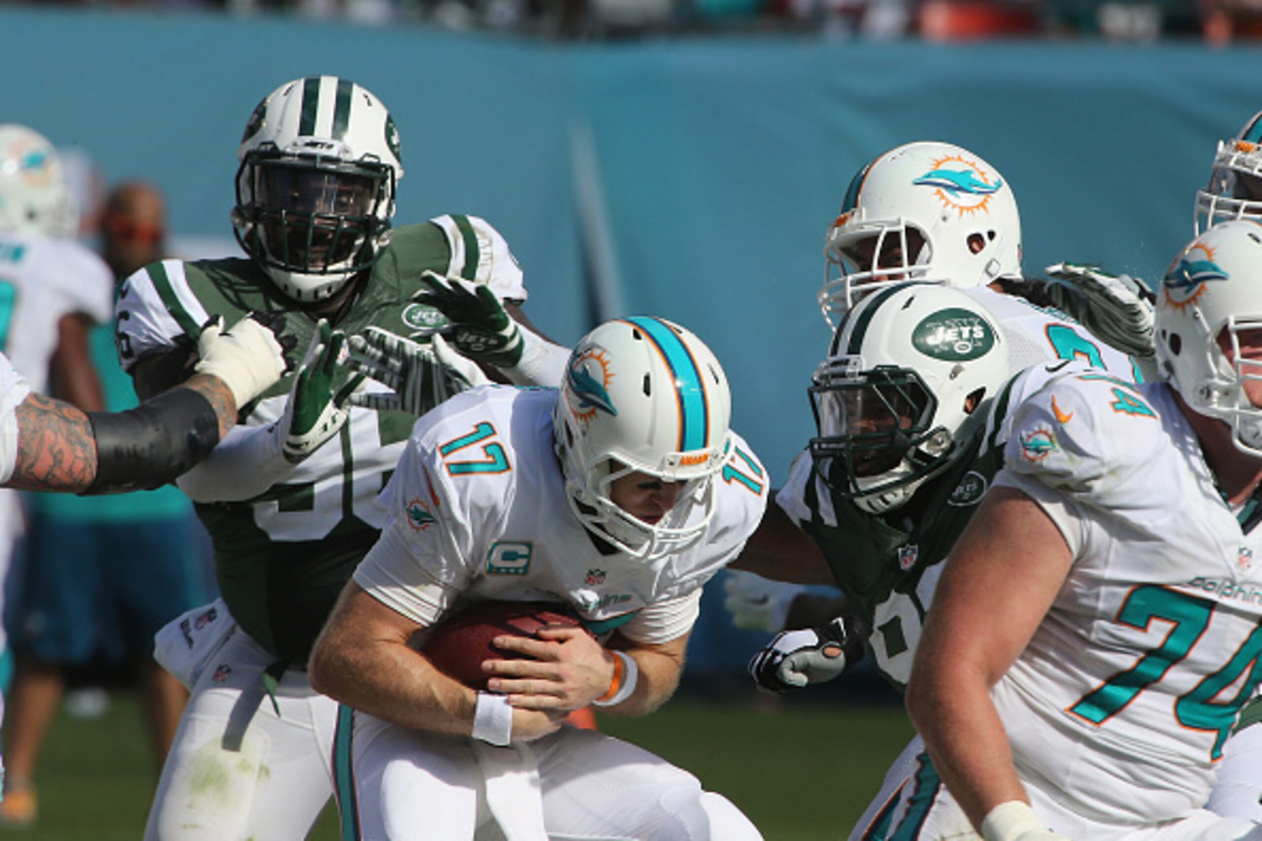 MIAMI GARDENS, FL - DECEMBER 28: Defensive Lineman Muhammad Wilkerson #96 and Sheldon Richardson #91 of the New York Jets sack Quarterback Ryan Tannehill #17 of the Miami Dolphins at Sun Life Stadium on December 28, 2014 in Miami Gardens, Florida. (Photo 