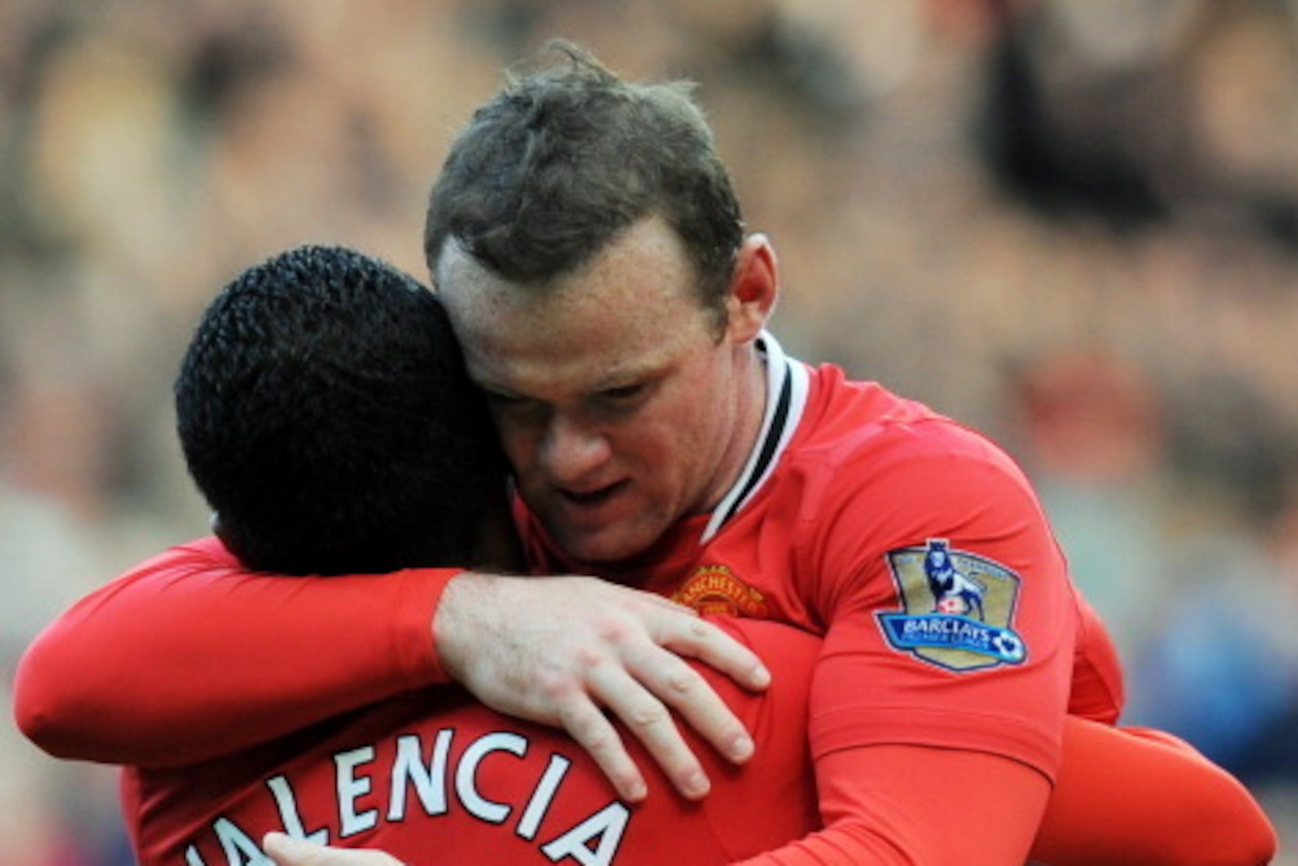 Manchester United's English forward Wayne Rooney (R) celebrates with Ecuador midfielder Antonio Valencia after scoring his second goal during the English Premier League football match between Manchester United and Aston Villa at Old Trafford in Manchester