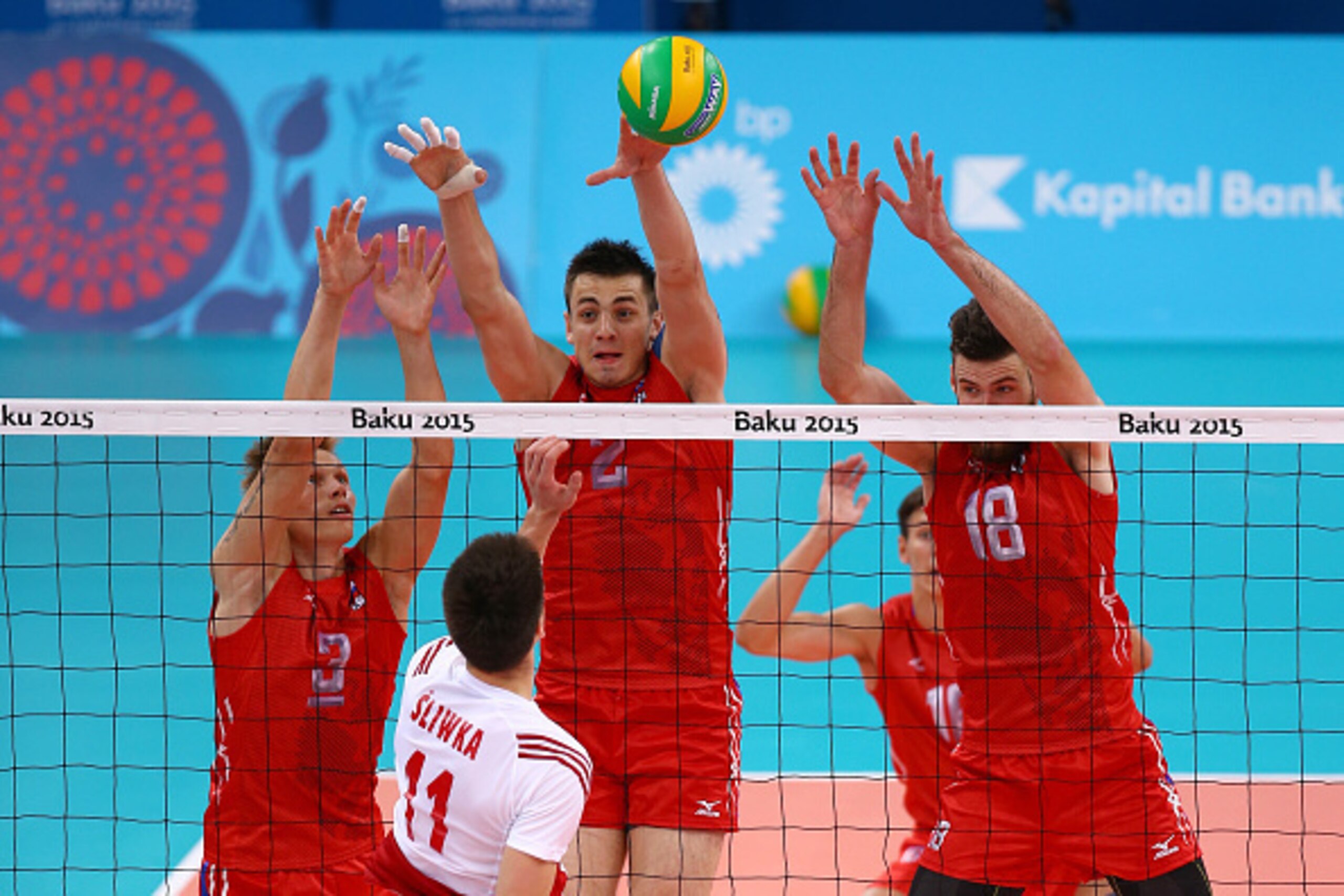 BAKU, AZERBAIJAN - JUNE 28:  Aleksander Sliwka (11) of Poland is faced by Dmitry Kovalev (3), Ilia Vlasov (2) and Egor Kliuka (18) of Russia at the net during the Men's bronze medal match between Poland and Russia on day sixteen of the Baku 2015 European 