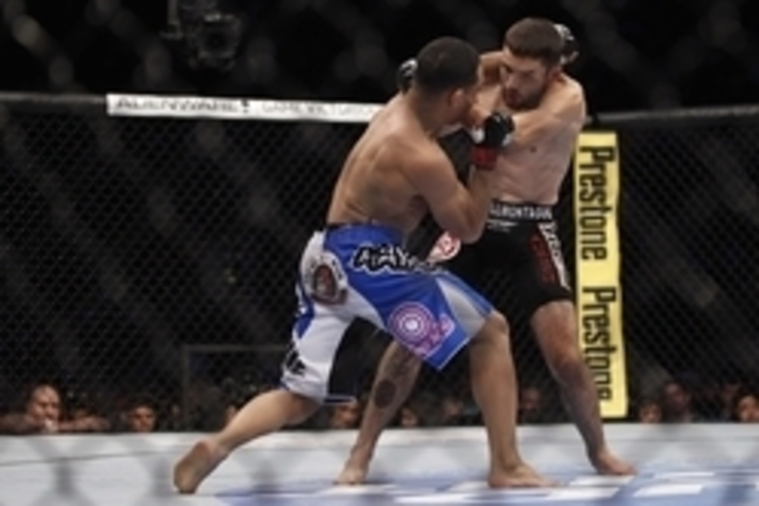 Oct 19, 2013; Houston, TX, USA; John Dodson (red gloves) fights against Darrell Montague (blue gloves) in their flyweight bout during UFC 166 at Toyota Center. Mandatory Credit: Andrew Richardson-USA TODAY Sports