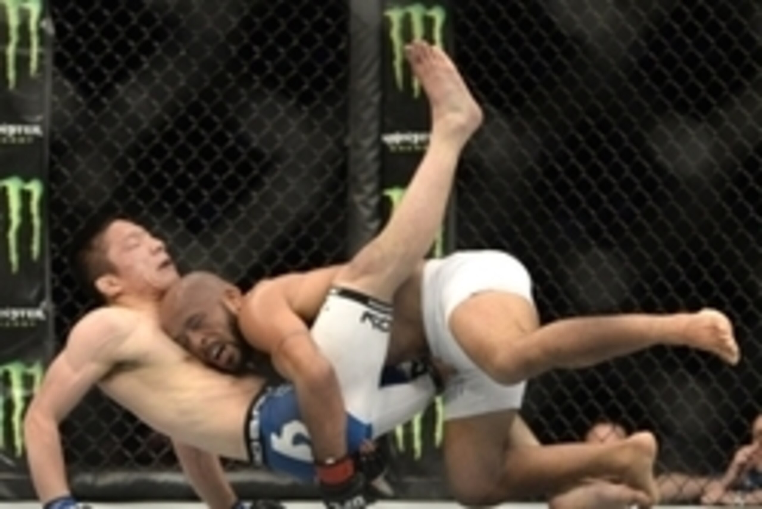 Apr 25, 2015; Montreal, Quebec, CAN; Demetrious Johnson (red) and Kyoji Horiguchi (blue) fight during their flyweight bout during UFC 186 at Bell Centre. Mandatory Credit: Eric Bolte-USA TODAY Sports