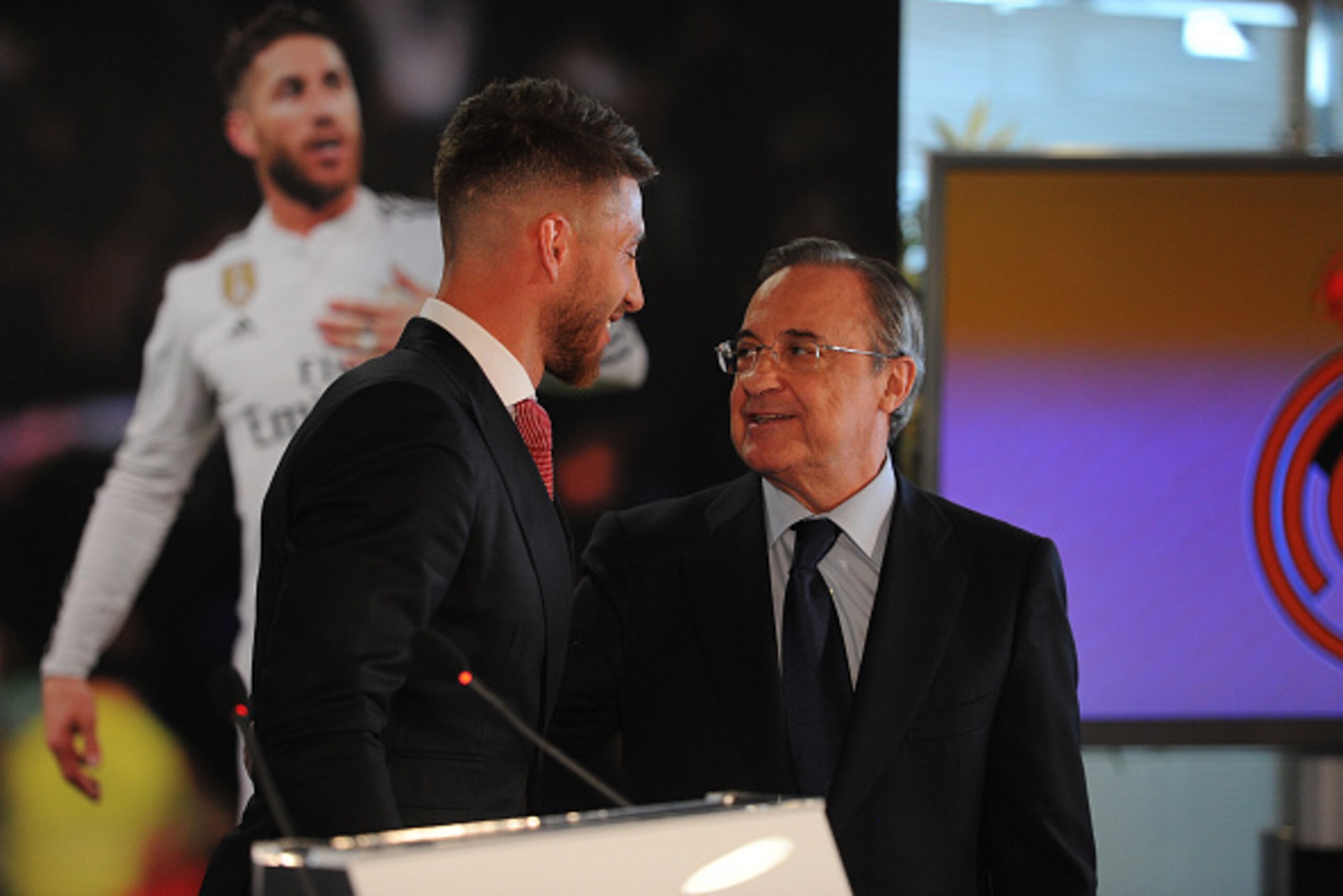 MADRID, SPAIN - AUGUST 17:  Sergio Ramos of Real Madrid smiles at Real president Florentino Perez during a press conference to announce Ramos' new five-year contract with Real Madrid at the Santiago Bernabeu stadium on August 17, 2015 in Madrid, Spain.  (