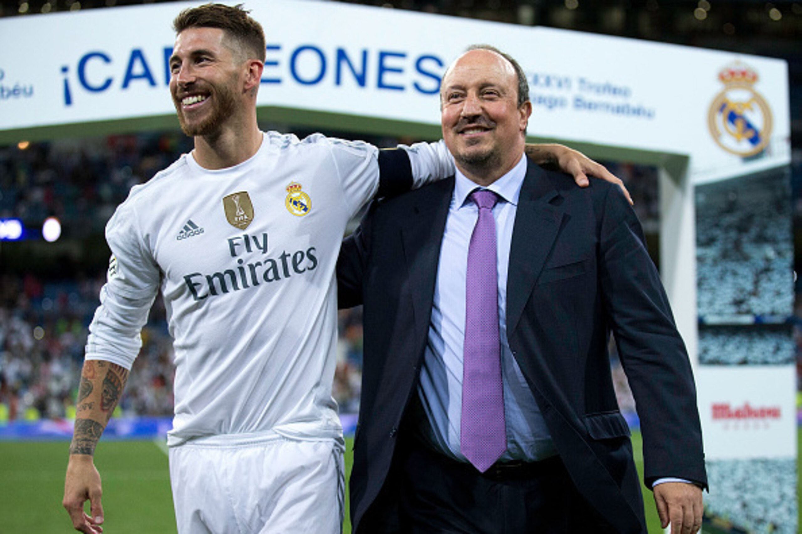 MADRID, SPAIN - AUGUST 18: Captain Sergio Ramos (L) of Real Madrid CF embraces his head coach Rafael Benitez (L) after winning the Santiago Bernabeu Trophy match between Real Madrid CF and Galatasaray  at Estadio Santiago Bernabeu on August 18, 2015 in Ma