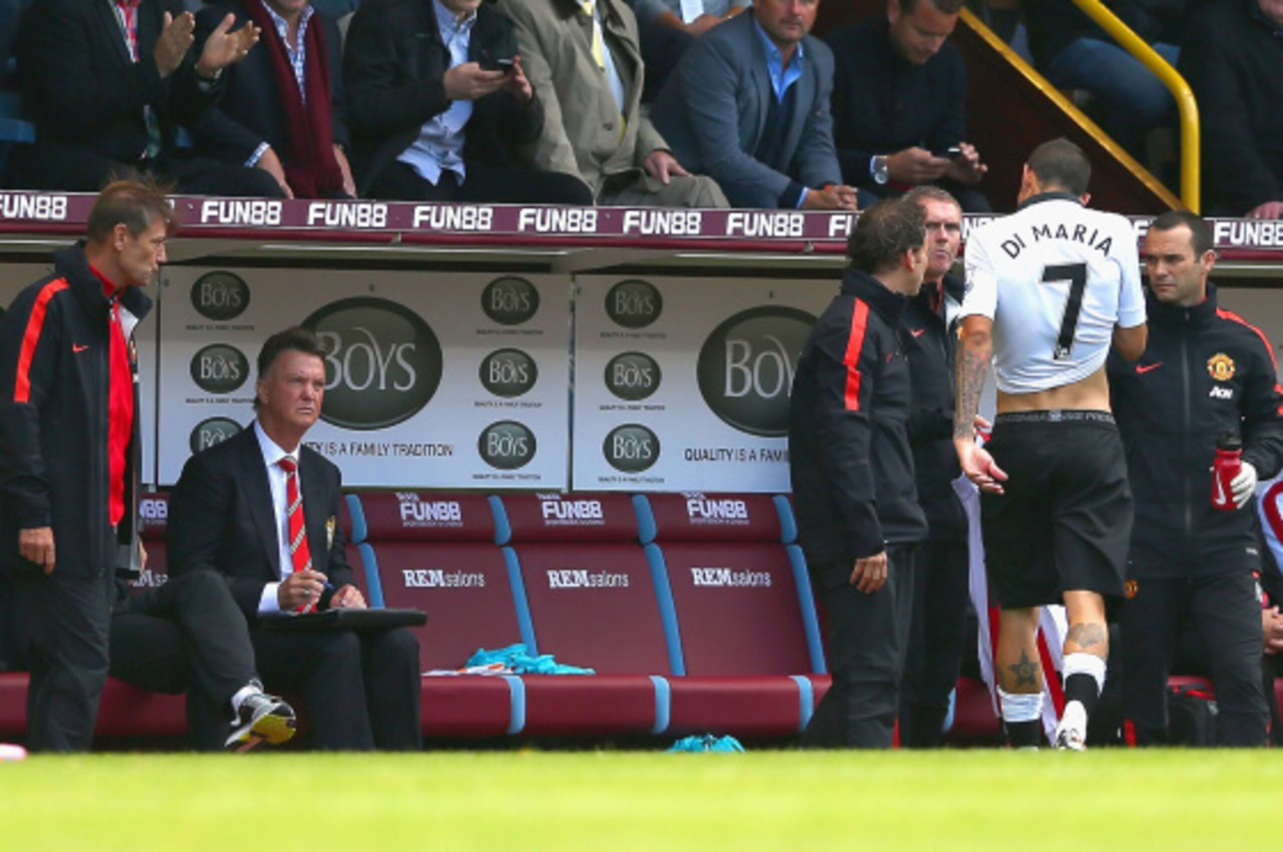 BURNLEY, ENGLAND - AUGUST 30:  Manager Louis van Gaal of Manchester United looks on as Angel di Maria of Manchester United is handed his tracksuit top as he is substituted during the Barclays Premier League match between Burnley and Manchester United at T