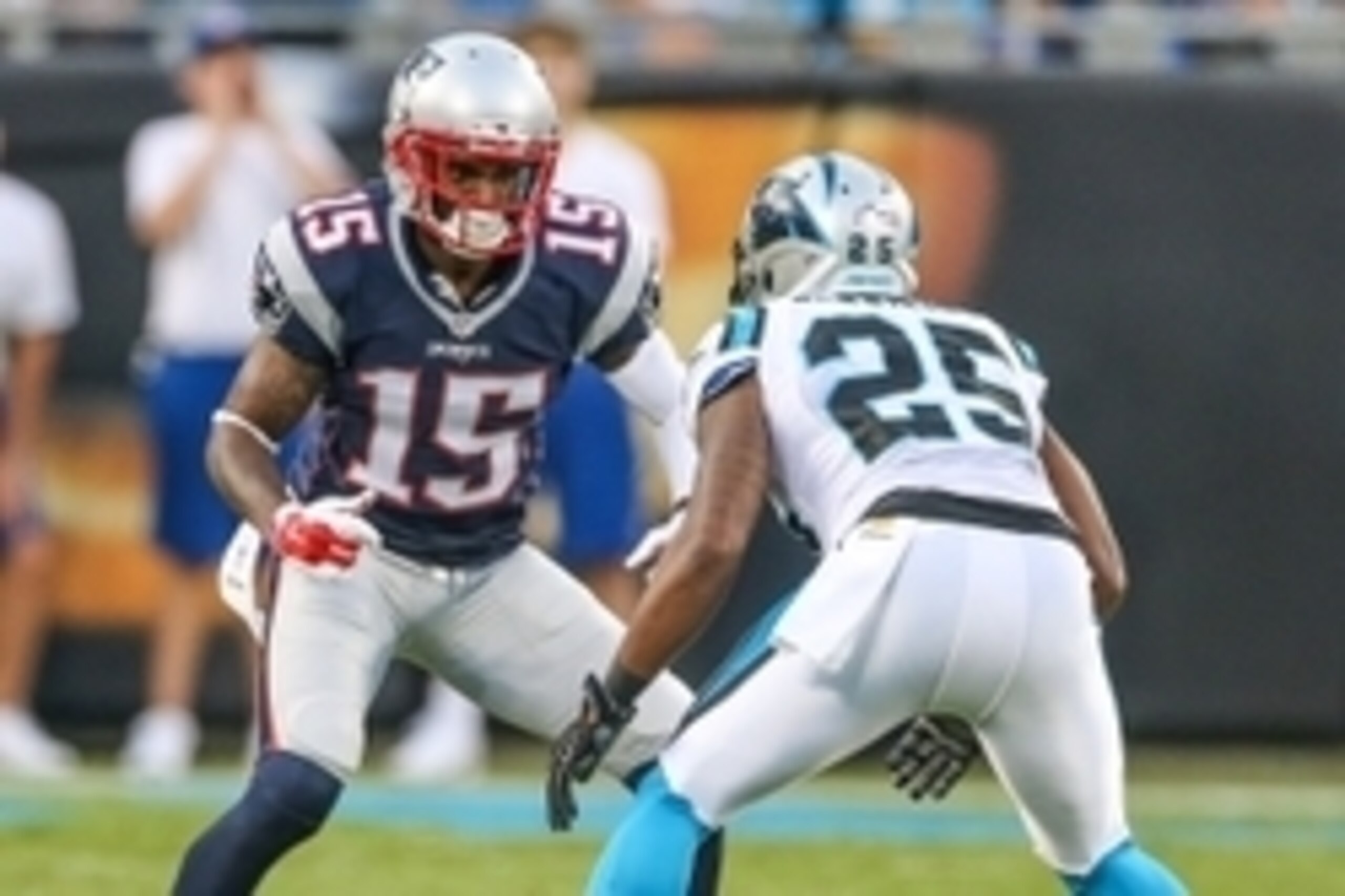 Aug 28, 2015; Charlotte, NC, USA; New England Patriots wide receiver Reggie Wayne (15) tries to get past Carolina Panthers cornerback Bene' Benwikere (25) during the first quarter at Bank of America Stadium. New England wins 17-16 over the Panthers. Manda
