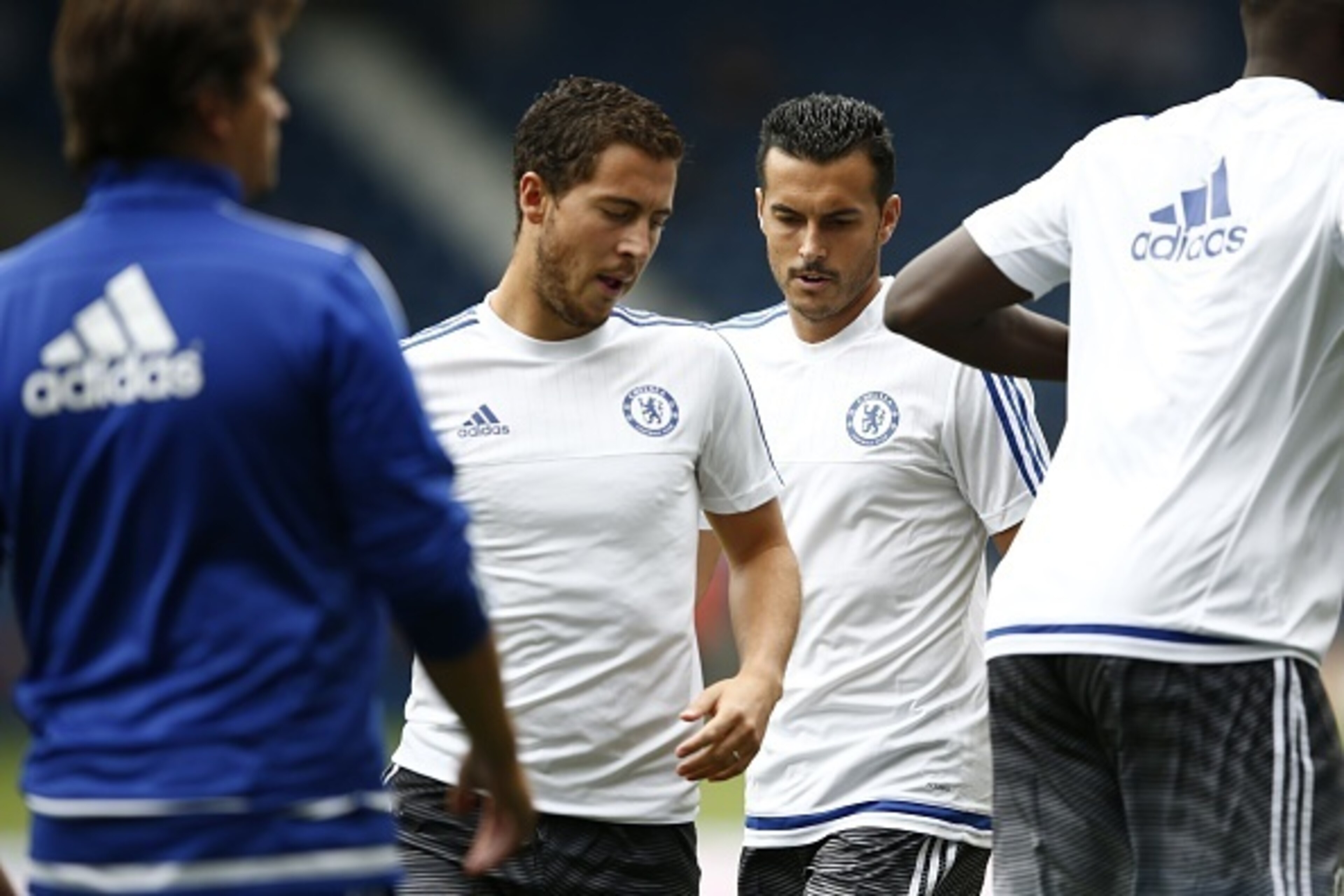Chelsea's Belgian midfielder Eden Hazard (2nd L) and Chelsea's Spanish midfielder Pedro (2nd R) warm up ahead of the English Premier League football match between West Bromwich Albion and Chelsea at The Hawthorns in West Bromwich, central England on Augus