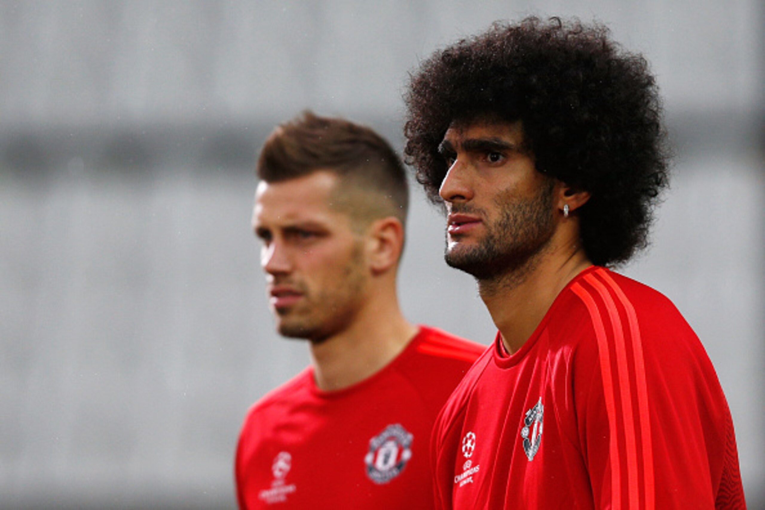BRUGGE, BELGIUM - AUGUST 25:  Marouane Fellaini (R) and Morgan Schneiderlin of Manchester United warm up during the Manchester United training session held at Jan Breydel Stadium on August 25, 2015 in Brugge, Belgium.  (Photo by Dean Mouhtaropoulos/Getty 