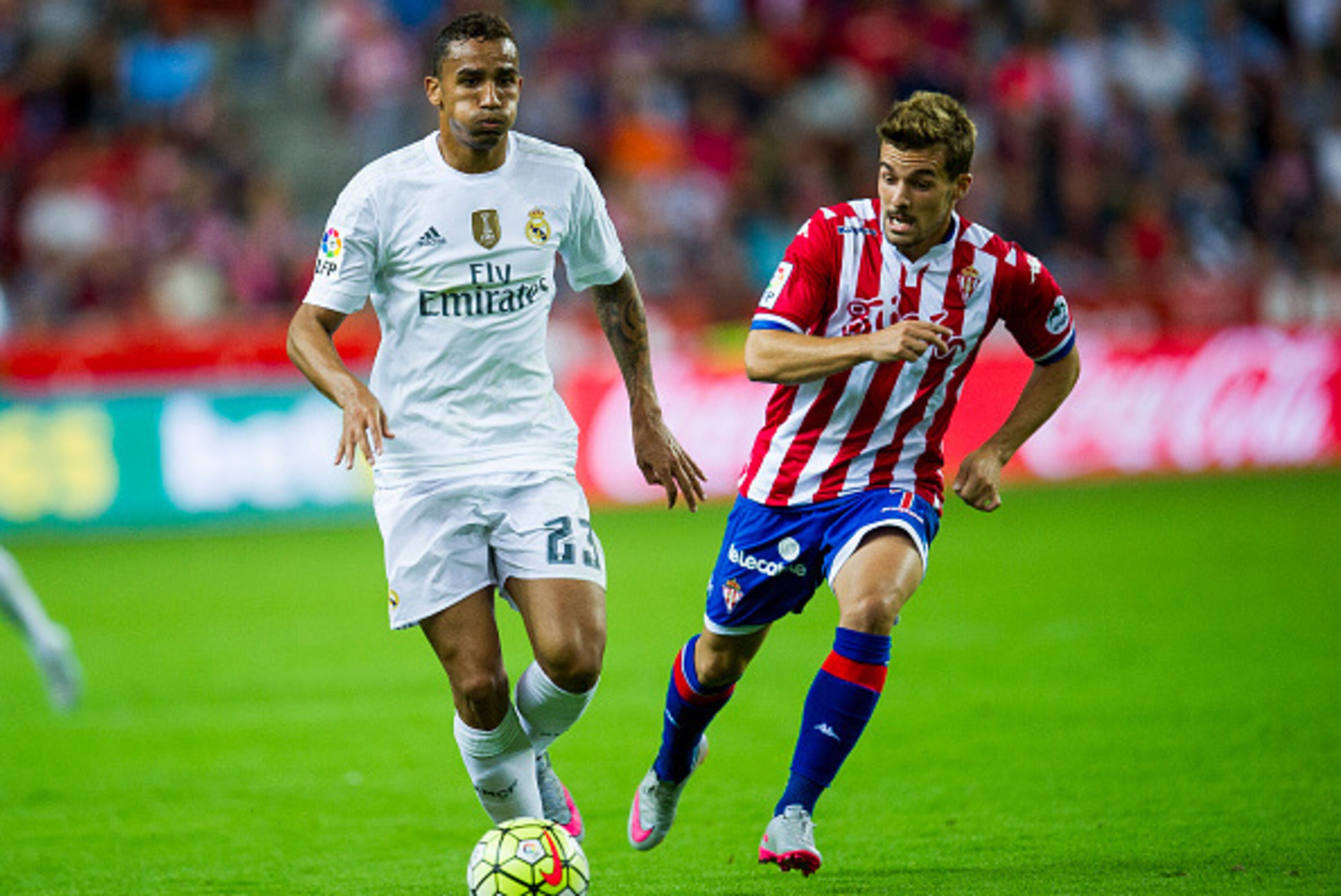GIJON, SPAIN - AUGUST 23:  Danilo of Real Madrid duels for the ball with Juan Muniz of Real Sporting de Gijon during the La Liga match between Sporting Gijon and Real Madrid at Estadio El Molinon on August 23, 2015 in Gijon, Spain.  (Photo by Juan Manuel 