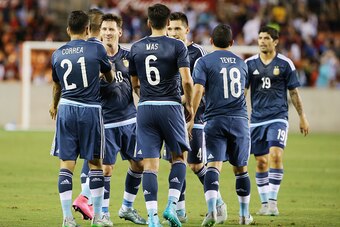 HOUSTON, TX - SEPTEMBER 04:  Angel Correa #21 of Argentina celebrates with his teammates after Correa scored a goal against Bolivia during their International friendly match at BBVA Compass Stadium on September 4, 2015 in Houston, Texas.  (Photo by Scott 