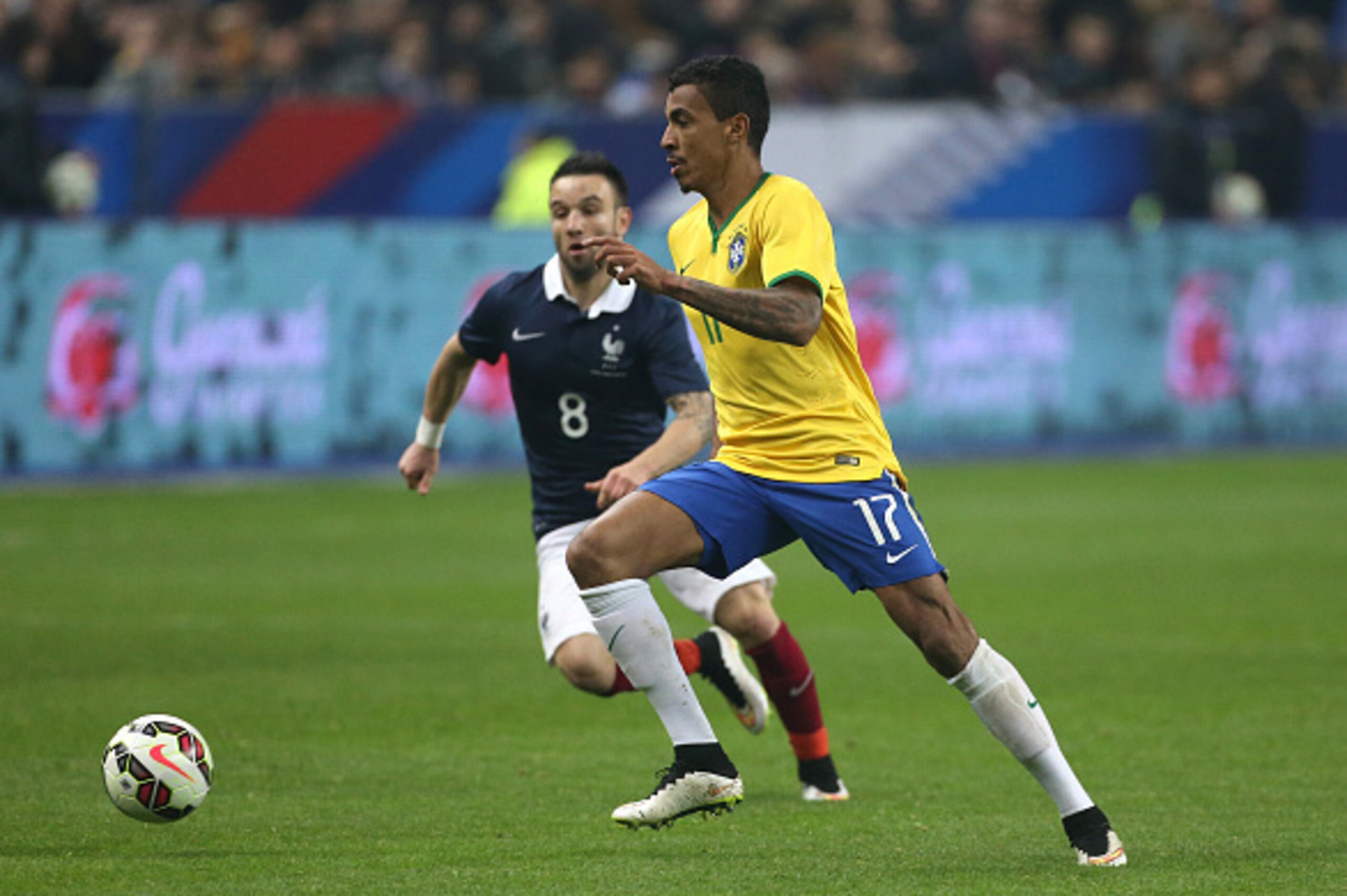PARIS, FRANCE - MARCH 26: Luiz Gustavo of Brazil and Mathieu Valbuena of France in action during the international friendly match between France and Brazil at Stade de France on March 26, 2015 in Saint-Denis near Paris, France. (Photo by Jean Catuffe/Gett
