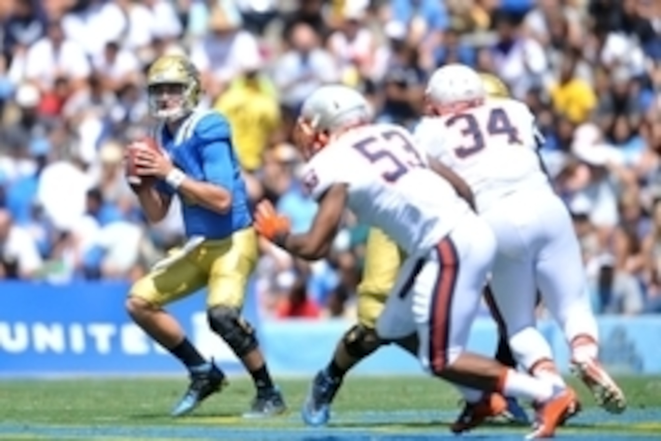 September 5, 2015; Pasadena, CA, USA; UCLA Bruins quarterback Josh Rosen (3) scrambles to pass against the Virginia Cavaliers during the first half at the Rose Bowl. Mandatory Credit: Gary A. Vasquez-USA TODAY Sports