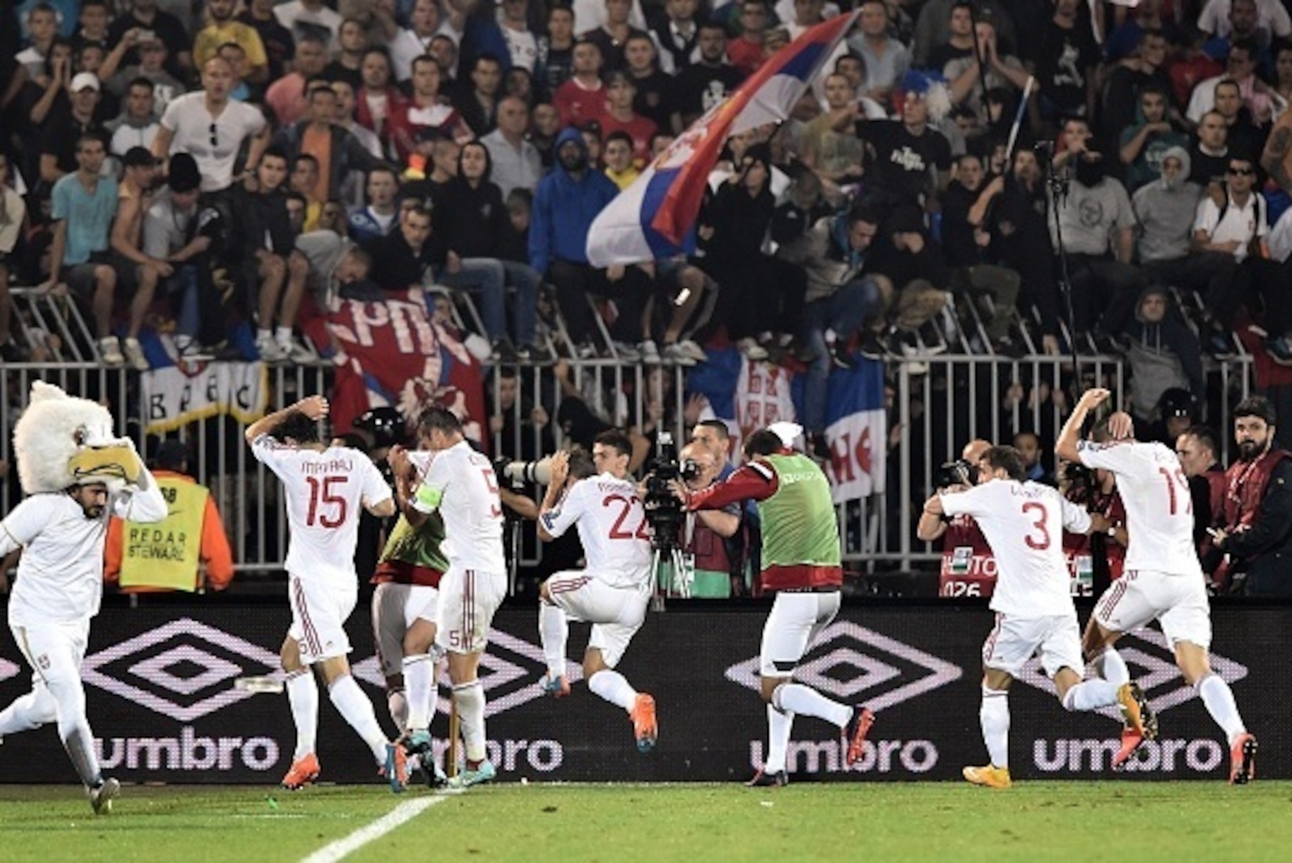 Albania's players run for cover during the EURO 2016 group I football match between Serbia and Albania in Belgrade on October 14, 2014. AFP PHOTO / ANDREJ ISAKOVIC (Photo credit should read ANDREJ ISAKOVIC/AFP/Getty Images) Albania's players run for cover during the EURO 2016 group I football match between Serbia and Albania in Belgrade on October 14, 2014. AFP PHOTO / ANDREJ ISAKOVIC (Photo credit should read ANDREJ ISAKOVIC/AFP/Getty Images)