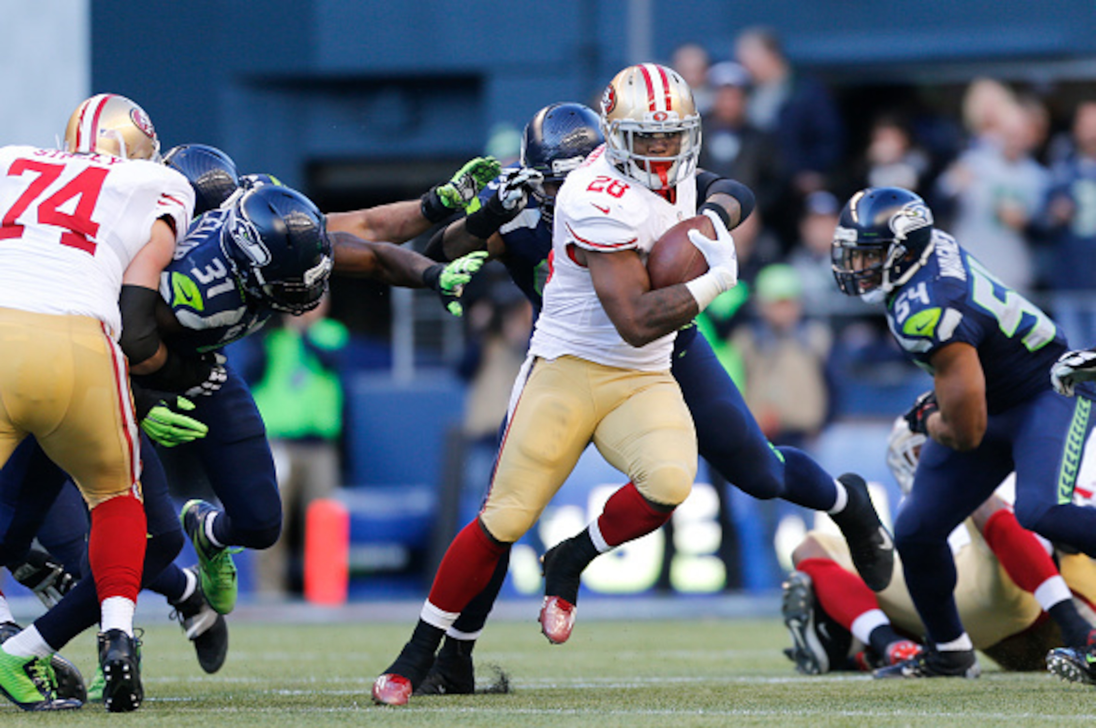 SEATTLE, WA - DECEMBER 14: Carlos Hyde #28 of the San Francisco 49ers rushes during the game against the Seattle Seahawks at  CenturyLink Field on December 14, 2014 in Seattle, Washington. The Seahawks defeated the 49ers 17-7. (Photo by Michael Zagaris/Sa