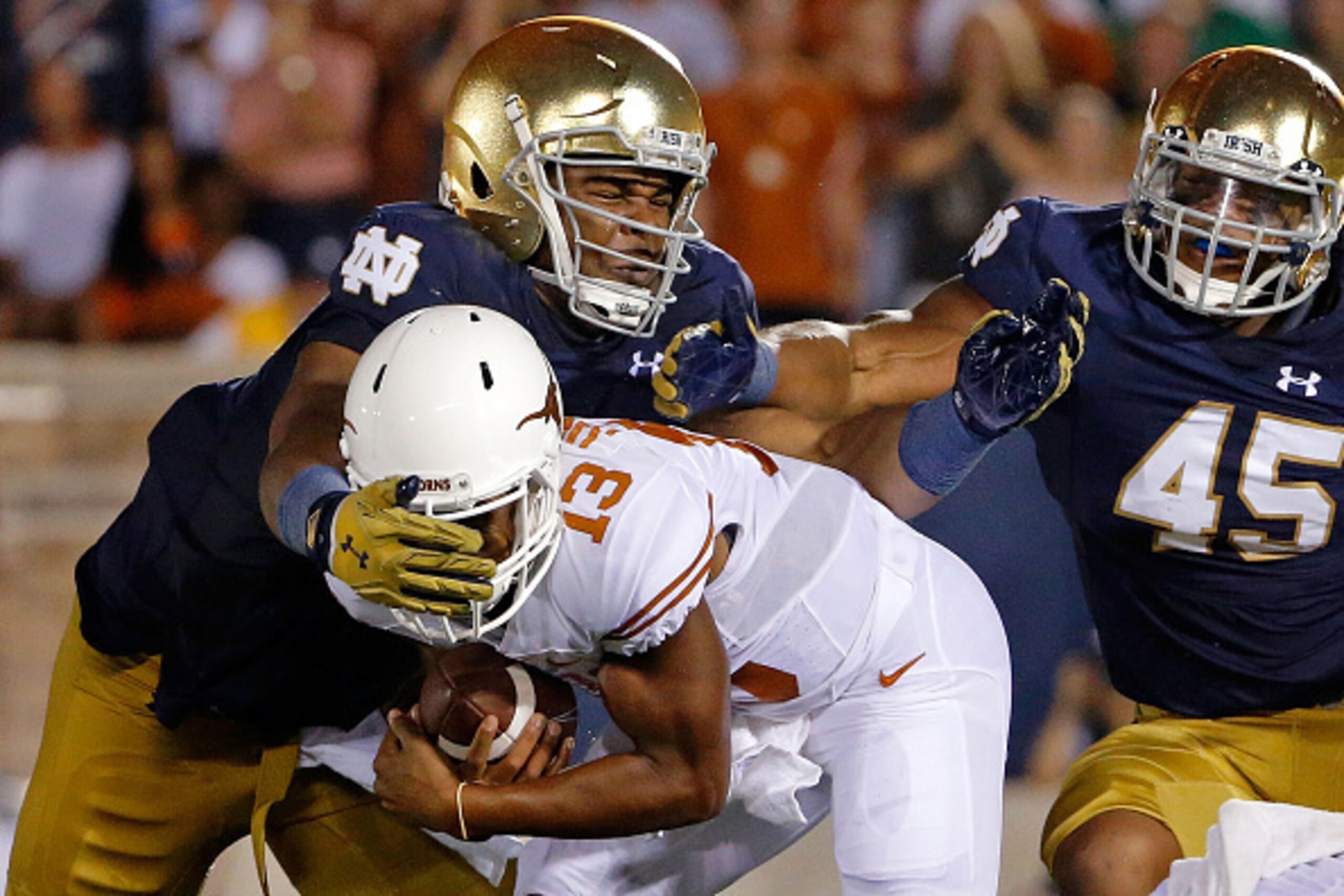 SOUTH BEND, IN - SEPTEMBER 05: Jerry Tillery #99 of the Notre Dame Fighting Irish tackles Jerrod Heard #13 of the Texas Longhorns for a loss of yards during the second quarter at Notre Dame Stadium on September 5, 2015 in South Bend, Indiana. (Photo by J SOUTH BEND, IN - SEPTEMBER 05: Jerry Tillery #99 of the Notre Dame Fighting Irish tackles Jerrod Heard #13 of the Texas Longhorns for a loss of yards during the second quarter at Notre Dame Stadium on September 5, 2015 in South Bend, Indiana. (Photo by J