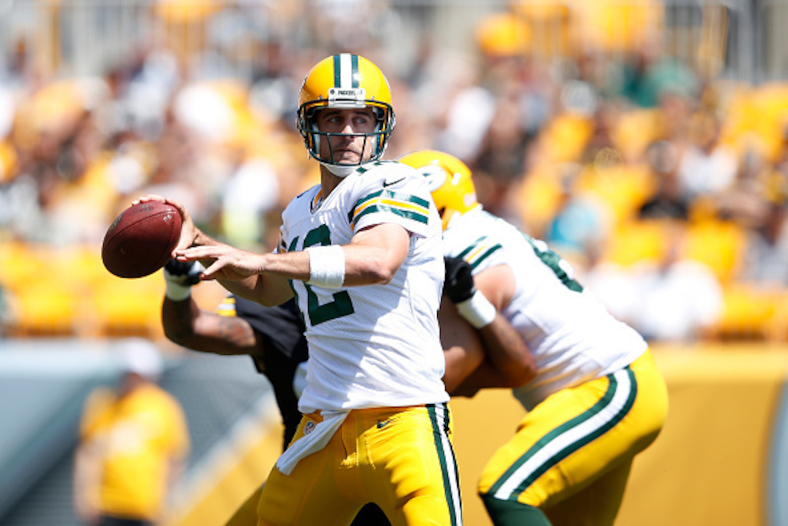 PITTSBURGH, PA - AUGUST 23: Aaron Rodgers #12 of the Green Bay Packers looks to pass during a preseason game against the Pittsburgh Steelers at Heinz Field on August 23, 2015 in Pittsburgh, Pennsylvania. The Steelers defeated the Packers 24-19. (Photo by 