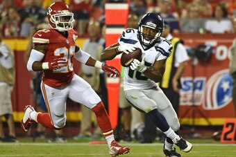 KANSAS CITY, MO - AUGUST 21:  Wide receiver Tyler Lockett #16 of the Seattle Seahawks turns up field after catching a pass against defensive back Steven Nelson #20 of the Kansas City Chiefs during the second half of a preseason game at Arrowhead Stadium o