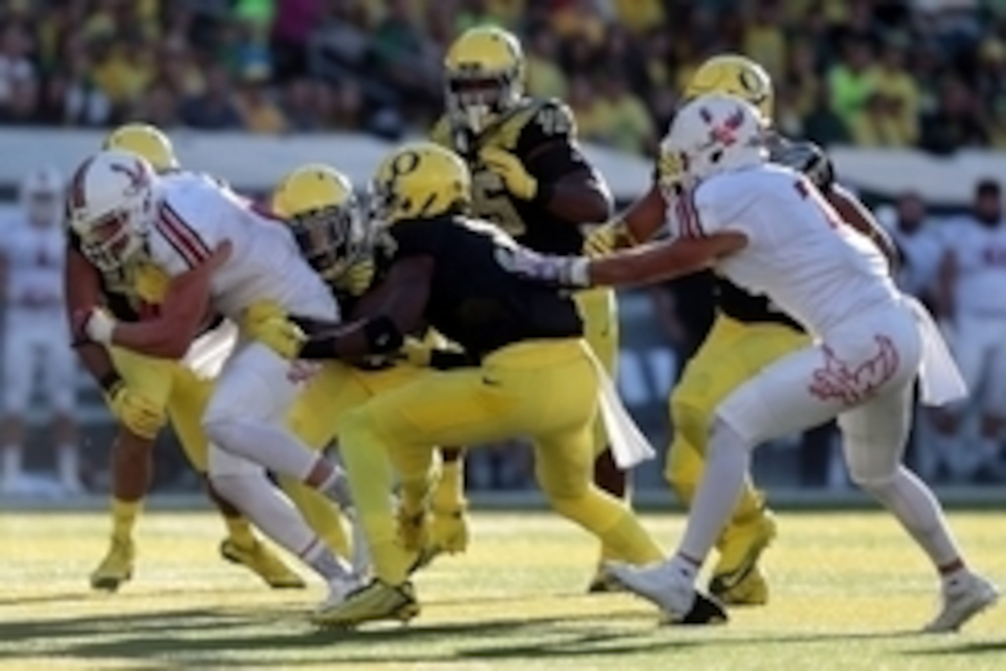 Sep 5, 2015; Eugene, OR, USA; Oregon Ducks cornerback Chris Seisay (12) and Oregon Ducks safety Tyree Robinson (3) hold on to Eastern Washington Eagles wide receiver Cooper Kupp (10) at Autzen Stadium. Mandatory Credit: Scott Olmos-USA TODAY Sports
