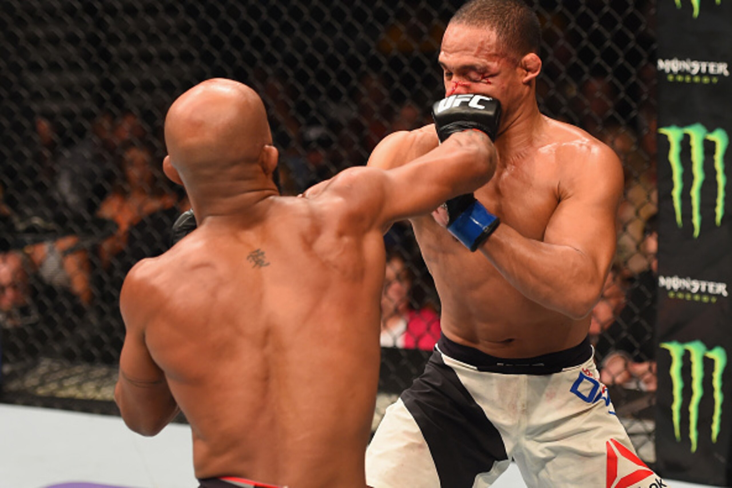 LAS VEGAS, NV - SEPTEMBER 05: (L-R) Demetrious Johnson punches John Dodson in their flyweight championship bout during the UFC 191 event inside MGM Grand Garden Arena on September 5, 2015 in Las Vegas, Nevada.  (Photo by Josh Hedges/Zuffa LLC/Zuffa LLC vi