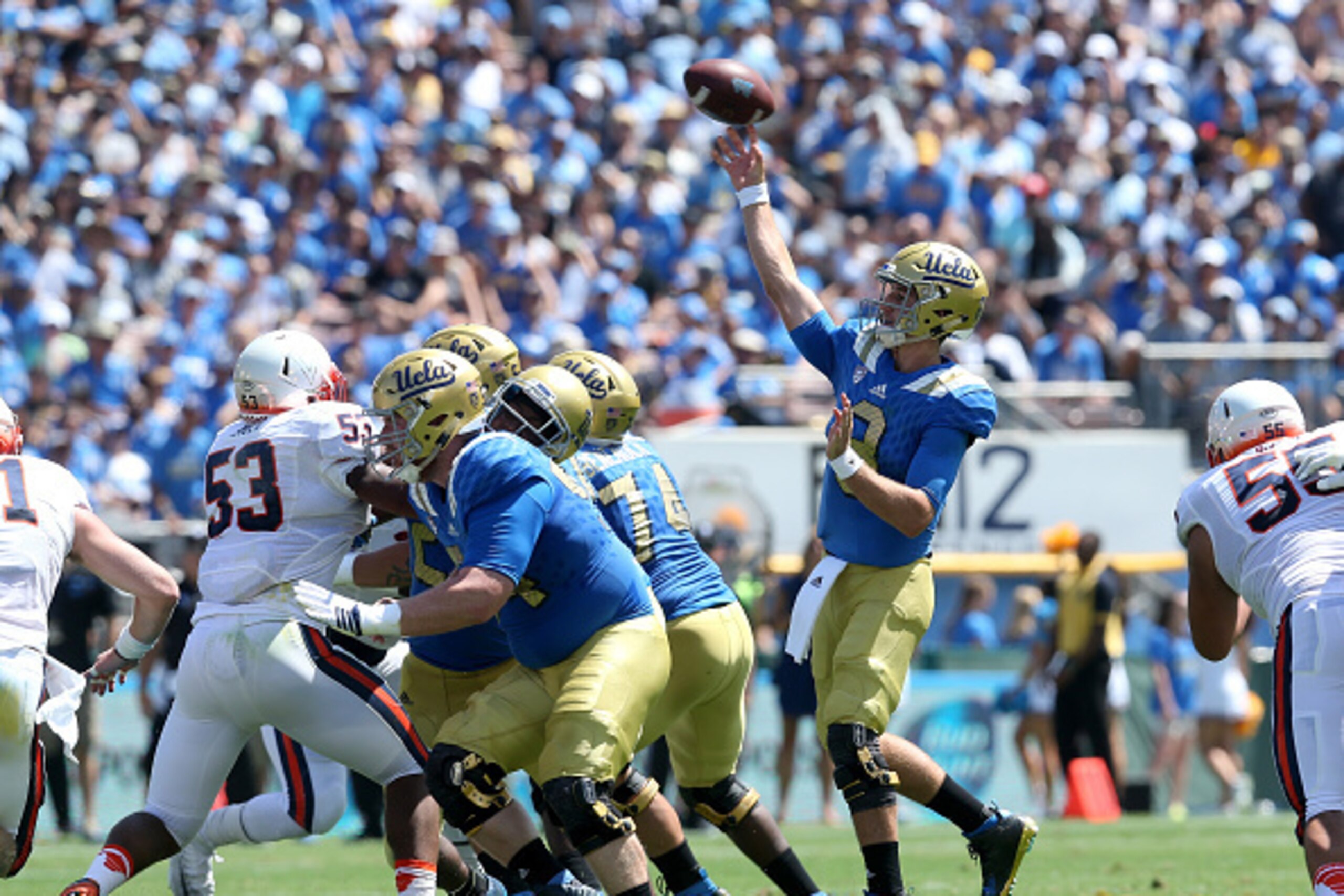 PASADENA, CA - SEPTEMBER 05:  Quarterback Josh Rosen #3 of the UCLA Bruins throws a 30 yard touchdown pass to Thomas Duarte in the first quarter against the Virginia Cavaliers at the Rose Bowl on September 5, 2015 in Pasadena, California.  UCLA won 34-16.