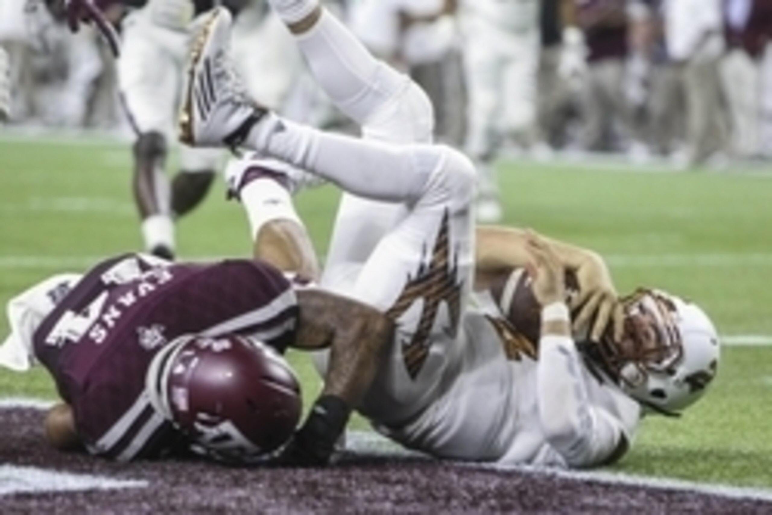 Sep 5, 2015; Houston, TX, USA; Arizona State Sun Devils quarterback Mike Bercovici (2) dives in to the end zone for a touchdown during the third quarter as Texas A&M Aggies defensive back Justin Evans (14) defends at NRG Stadium. Mandatory Credit: Troy Ta