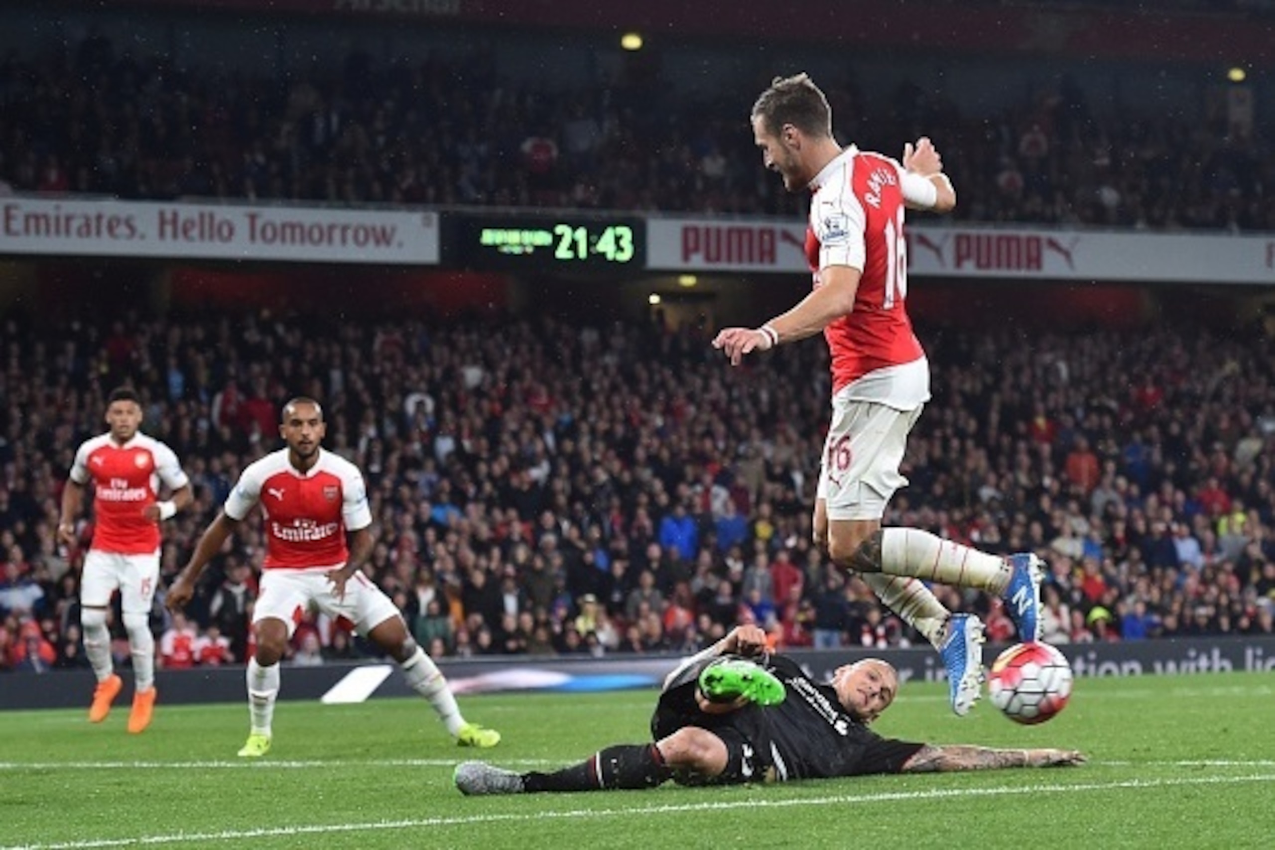Liverpool's Slovakian defender Martin Skrtel (down) blocks a shot by Arsenal's Welsh midfielder Aaron Ramsey during the English Premier League football match between Arsenal and Liverpool at the Emirates stadium, north London on August 24, 2015. AFP PHOTO