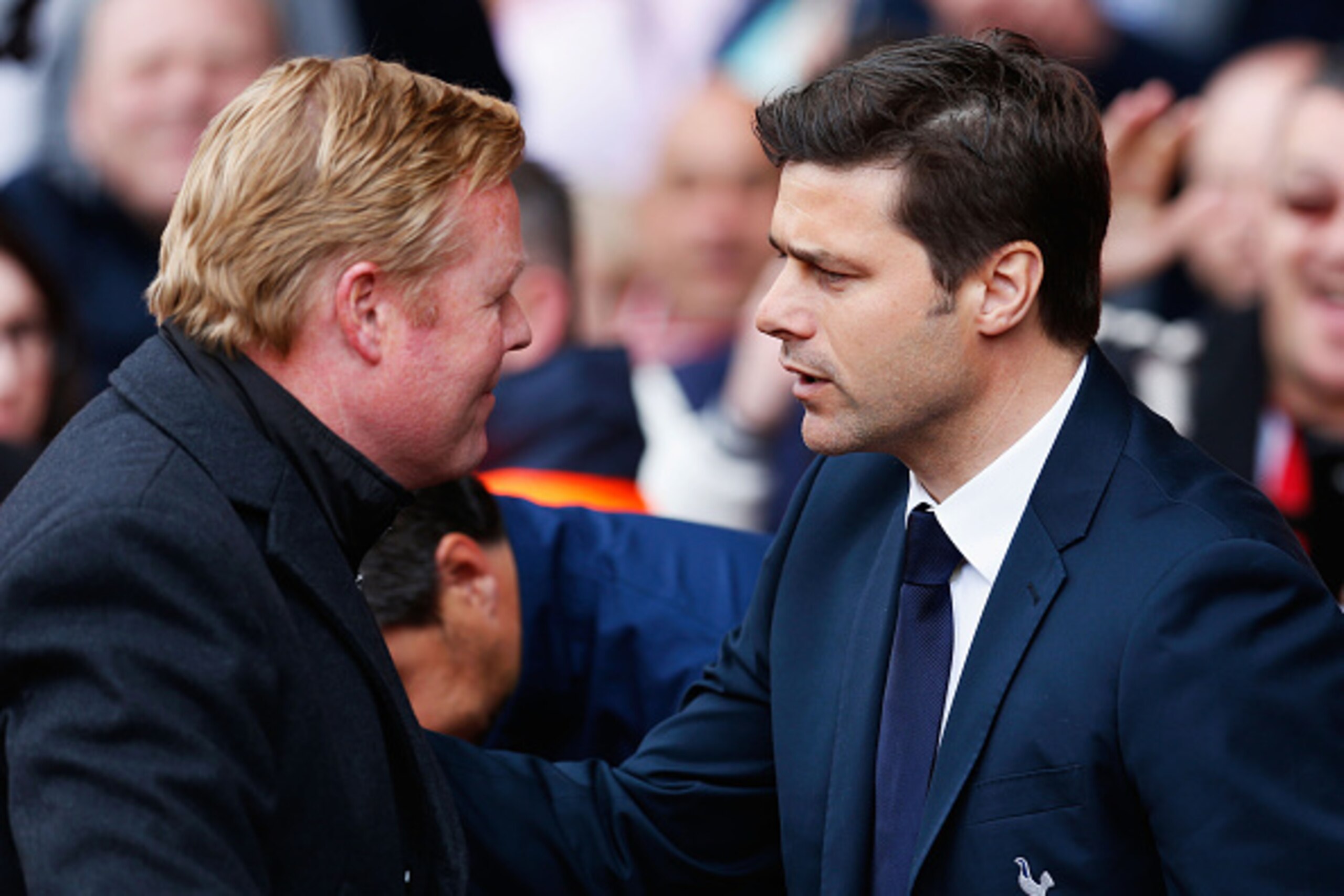 SOUTHAMPTON, ENGLAND - APRIL 25:  Ronald Koeman manager of Southampton greets Manager Mauricio Pochettino of Spurs during the Barclays Premier League match between Southampton and Tottenham Hotspur at St Mary's Stadium on April 25, 2015 in Southampton, En