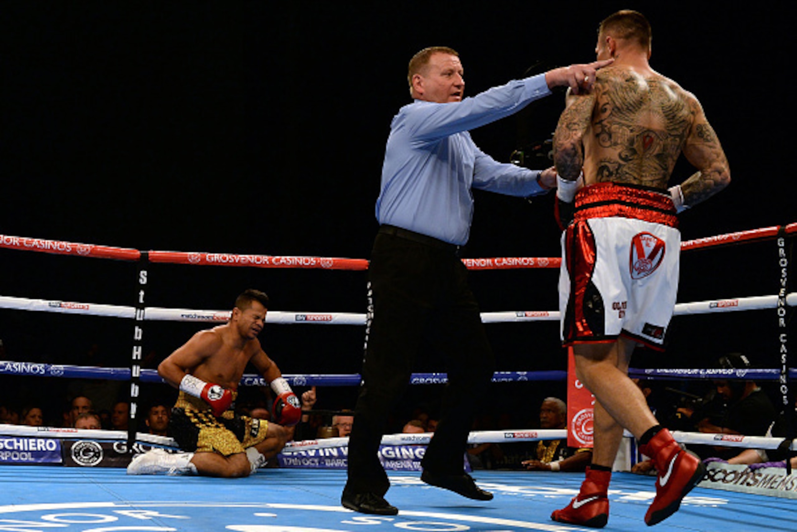 LEEDS, ENGLAND - SEPTEMBER 05:  Martin Murray (R) knocks down Jose Miguel Torres during their WBA Inter Continental Super Middleweight title boxing contest at First Direct Arena on September 5, 2015 in Leeds, England.  (Photo by Nigel Roddis/Getty Images)