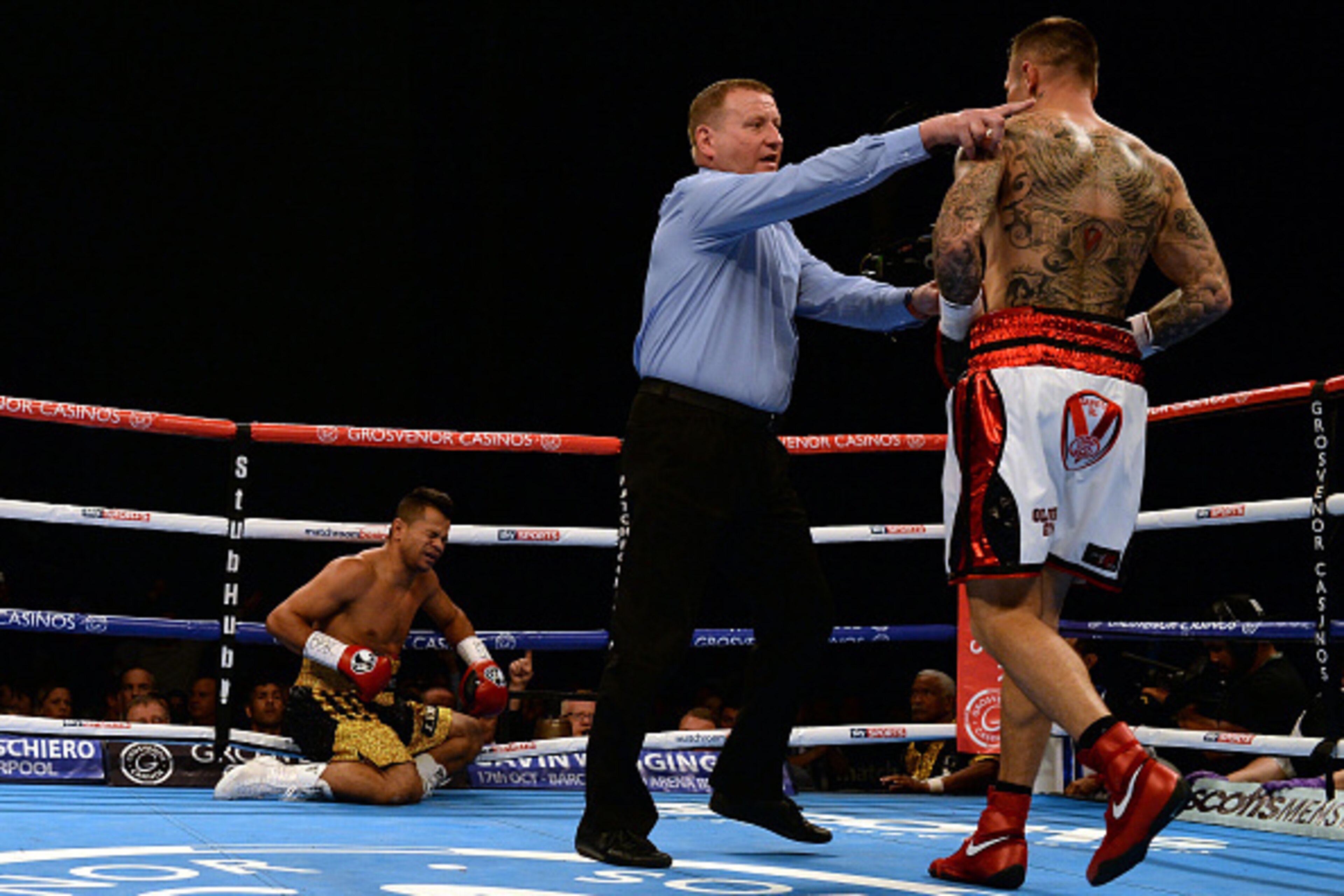 LEEDS, ENGLAND - SEPTEMBER 05:  Martin Murray (R) knocks down Jose Miguel Torres during their WBA Inter Continental Super Middleweight title boxing contest at First Direct Arena on September 5, 2015 in Leeds, England.  (Photo by Nigel Roddis/Getty Images)