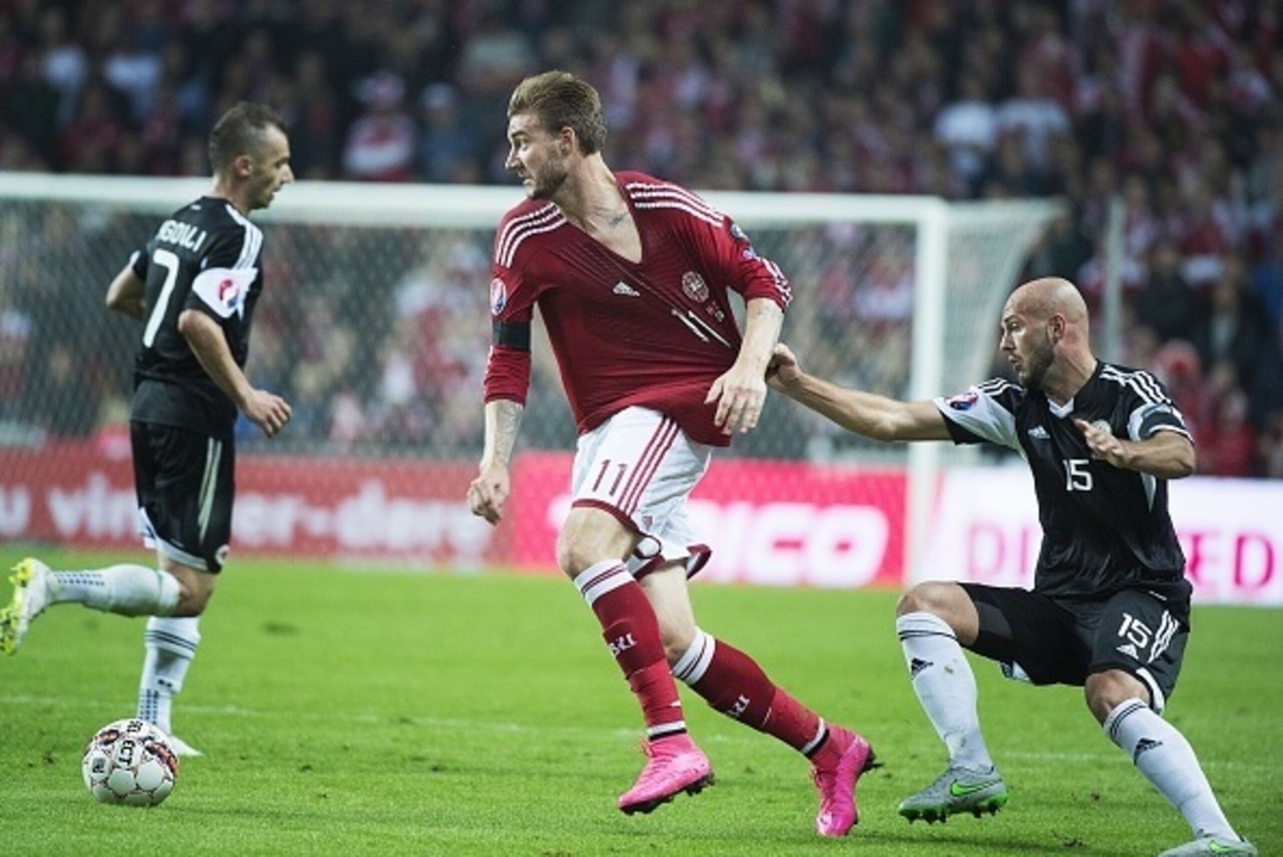 Albania's Arlind Ajeti (R) and Denmark's Nicklas Bendtner vie for the ball during the Euro 2016 qualifying football match between Denmark vs Albania in Copenhagen, Denmark, on September 5, 2015.  AFP PHOTO / SCANPIX /  CLAUS BECH DENMARK OUT        (Photo