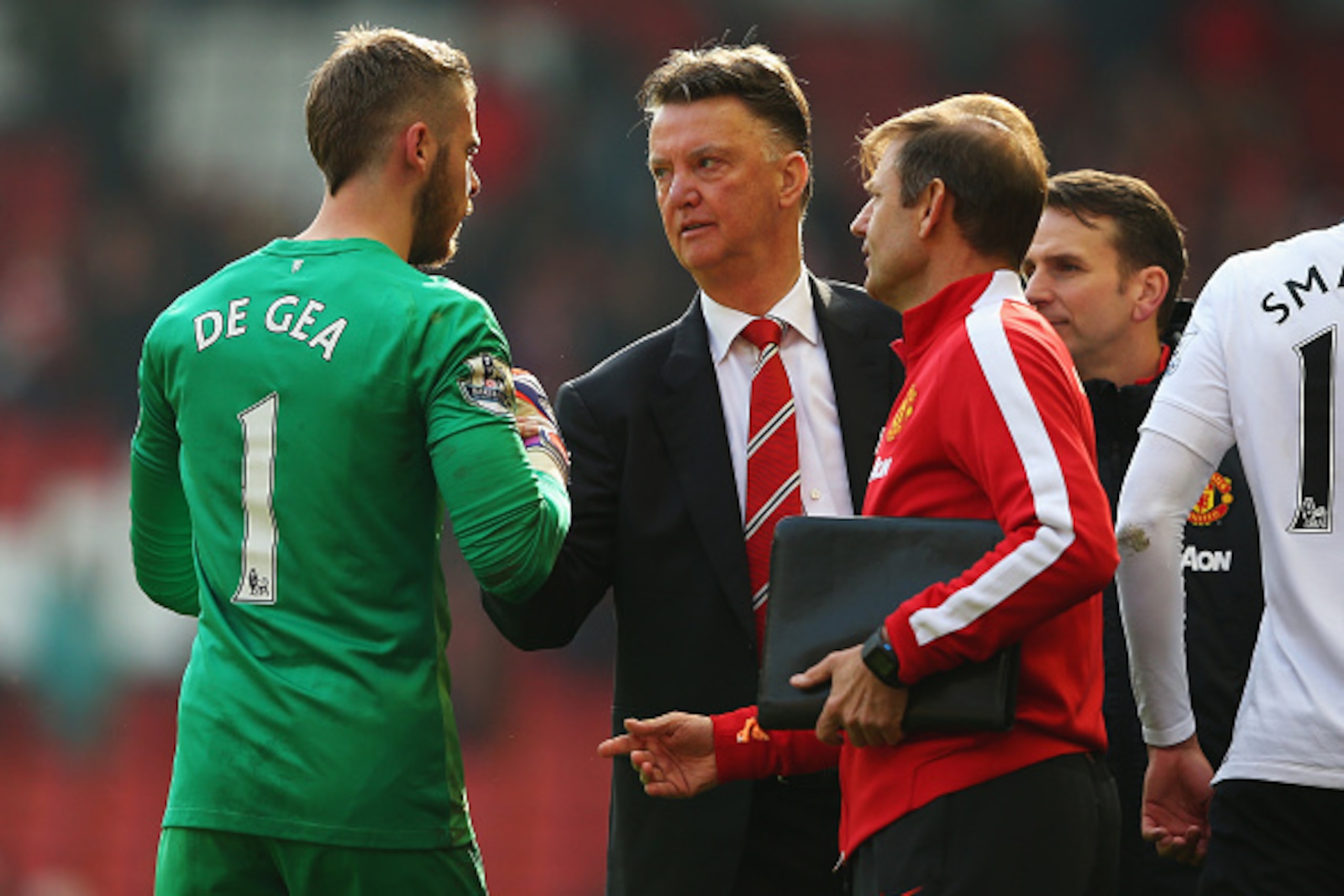 LIVERPOOL, ENGLAND - MARCH 22:  Louis van Gaal, manager of Manchester United celebrates victory with David De Gea of Manchester United after the Barclays Premier League match between Liverpool and Manchester United at Anfield on March 22, 2015 in Liverpoo