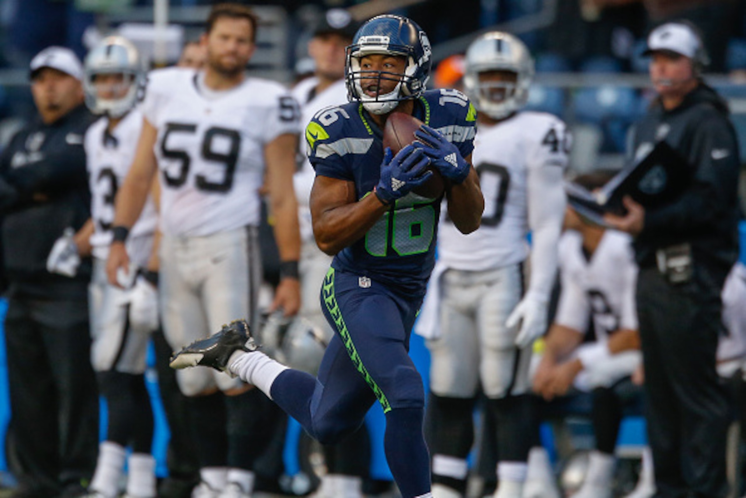 SEATTLE, WA - SEPTEMBER 03:  Wide receiver Tyler Lockett #16 of the Seattle Seahawks rushes for a touchdown on a 63 yard pass play in the first quarter against the Oakland Raiders at CenturyLink Field on September 3, 2015 in Seattle, Washington.  (Photo b