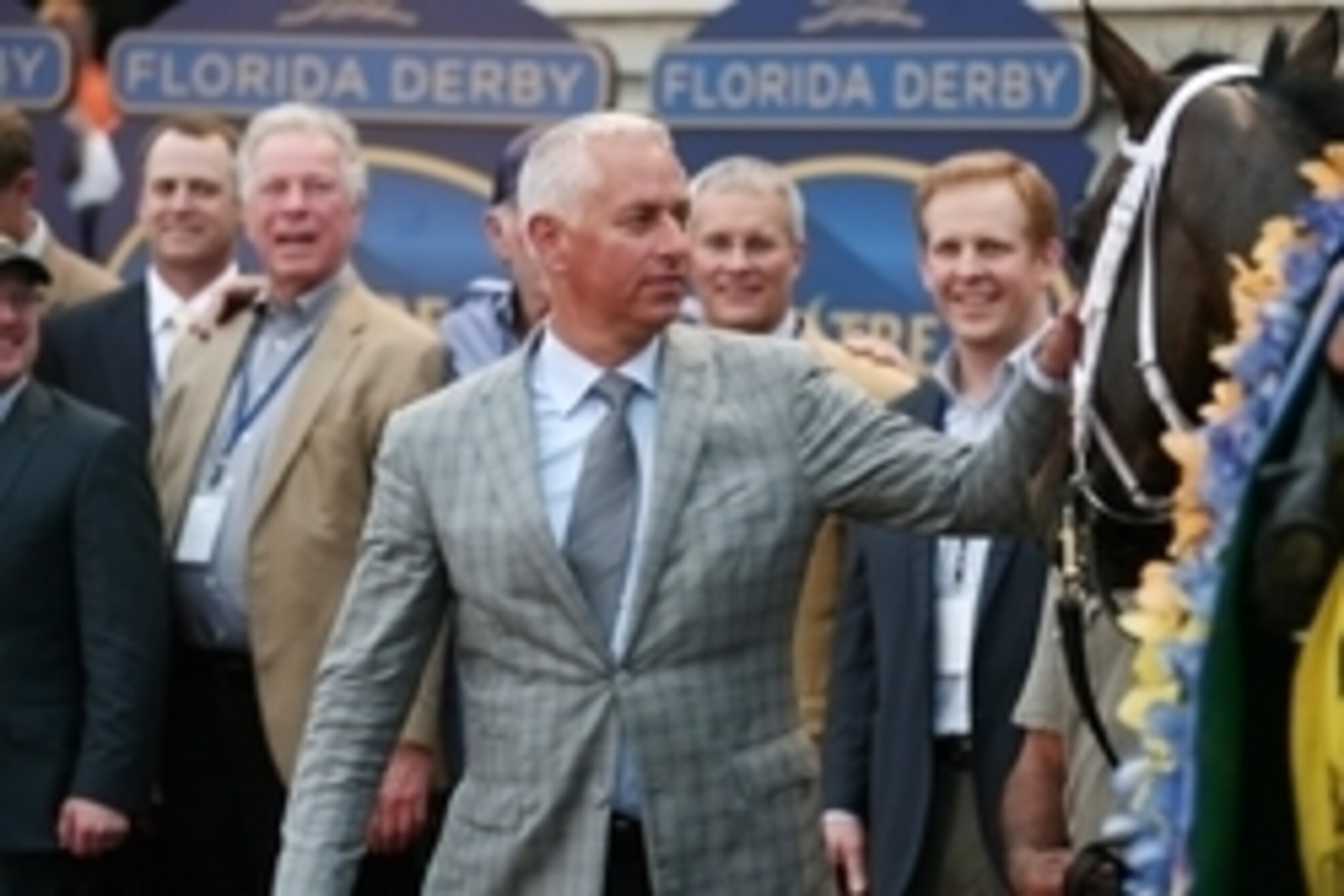 Mar 29, 2014; Hallandale Beach, FL, USA; Equestrian trainer Todd Pletcher pats Constitution after winning the Florida Derby at Gulfstream Park. Mandatory Credit: Mark Zerof-USA TODAY Sports