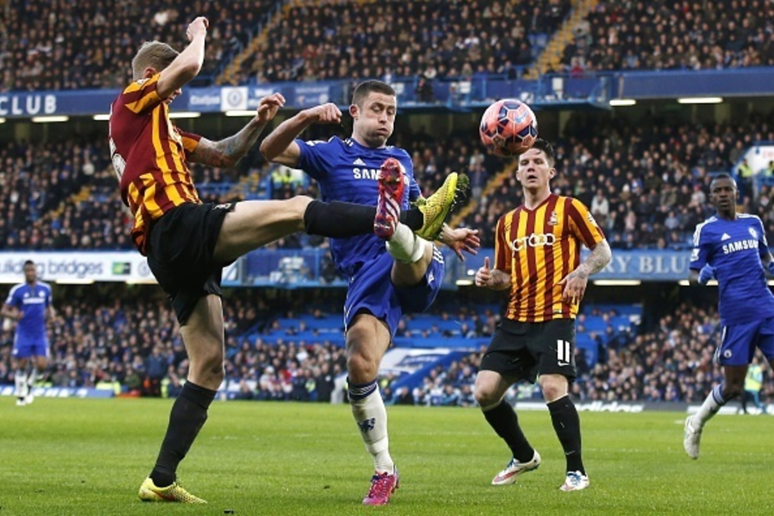 Bradford City's English striker Jon Stead (L) vies for the ball with Chelsea's English defender Gary Cahill (C) during the FA Cup fourth round football match between Chelsea and Bradford City at Stamford Bridge in London on January 24, 2015. Bradford City