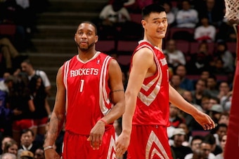 EAST RUTHERFORD, NJ - DECEMBER 22:  Tracy McGrady #1 and Yao Ming #11 of the Houston Rockets stand on the court during the game against the New Jersey Nets on  December 22, 2008 at the Izod Center  in East Rutherford, New Jersey.  The Rockets won 114-91. 