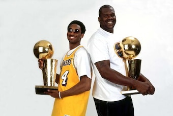 LOS ANGELES - JUNE 18:  Shaquille O'Neal #34 and Kobe Bryant #8 of the Los Angeles Lakers pose for a photo after the Lakers' 2001 NBA Championship parade held June 18, 2001 in Los Angeles, California.  NOTE TO USER: User expressly acknowledges that, by do