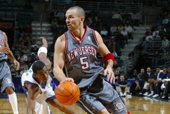 MILWAUKEE - DECEMBER 20:  Jason Kidd #5 of the New Jersey Nets moves the ball during the game against the Milwaukee Bucks on December 20, 2003 at Bradley Center in Milwaukee, Wisconsin.  The Bucks won 92-87.  NOTE TO USER:  User expressly acknowledges and